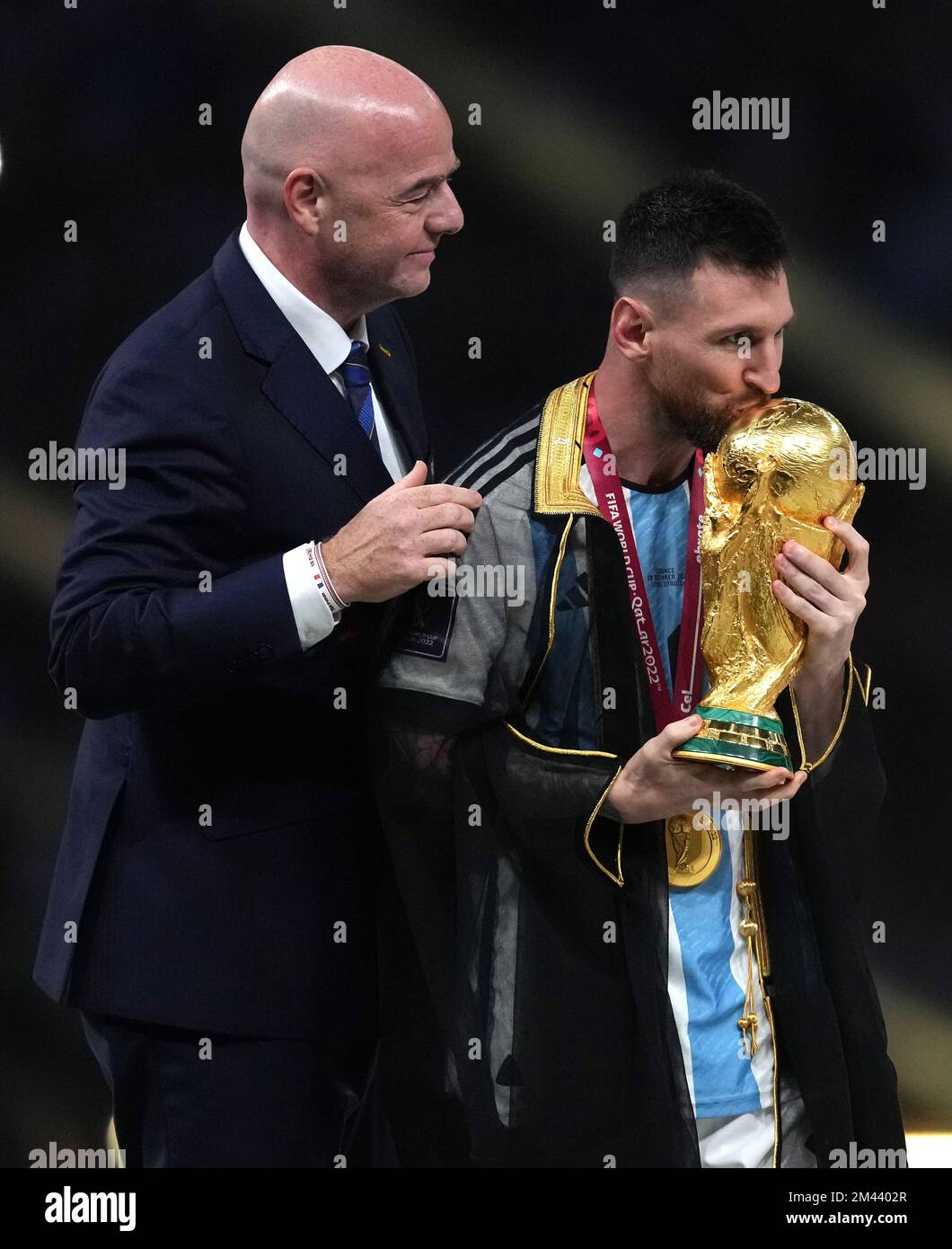 FIFA President Gianni Infantino (left) hands the FIFA World Cup Trophy