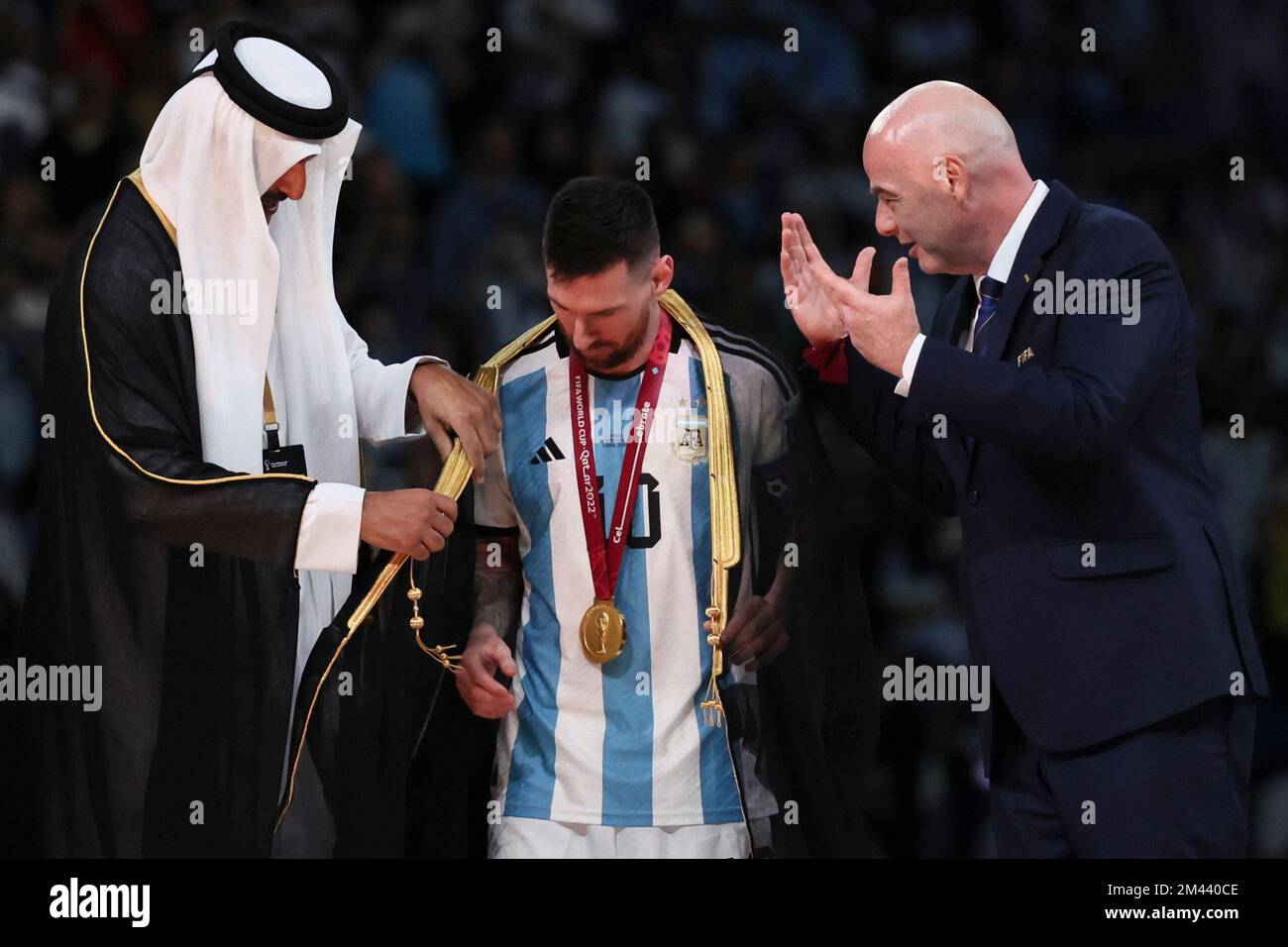 Lusail, Qatar. 18th Dec, 2022. FIFA President Gianni Infantino (R) and The Emir of Qatar Sheikh Tamim bin Hamad Al Thani (L) award Lionel Messi of Argentina during the awarding ceremony of the 2022 FIFA World Cup at Lusail Stadium in Lusail, Qatar, Dec. 18, 2022. Credit: Lan Hongguang/Xinhua/Alamy Live News/Alamy Live News Stock Photo