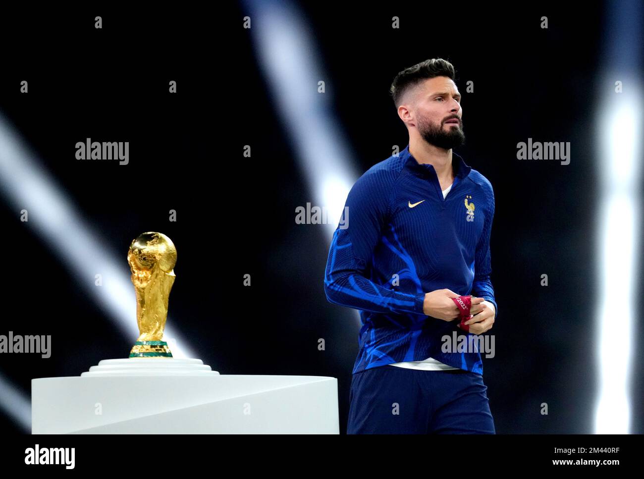 France's Olivier Giroud walks past the FIFA World Cup trophy after being presented with his second place medal following defeat in the FIFA World Cup final at Lusail Stadium, Qatar. Picture date: Sunday December 18, 2022. Stock Photo