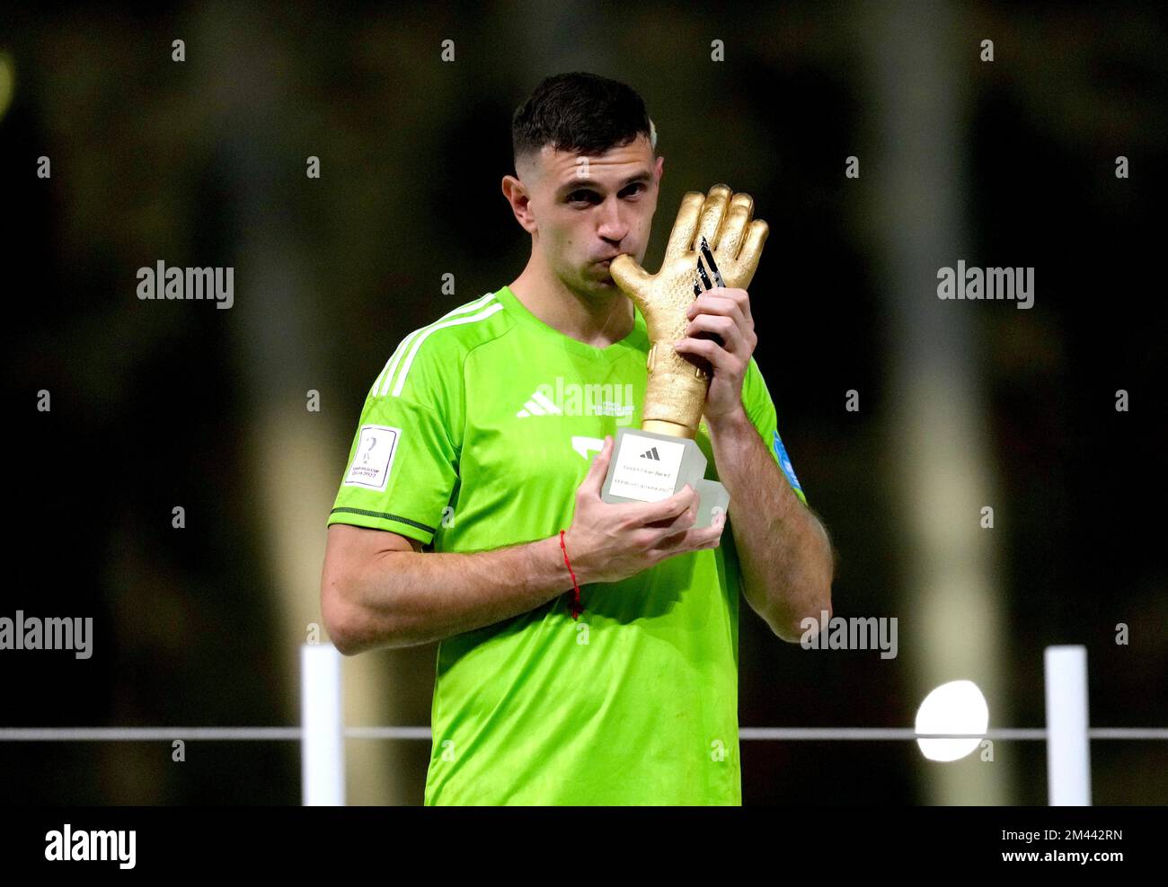 Argentina goalkeeper Emiliano Martinez celebrates with the Golden Glove award after being presented with it following victory in the FIFA World Cup final at Lusail Stadium, Qatar. Picture date: Sunday December 18, 2022. Stock Photo