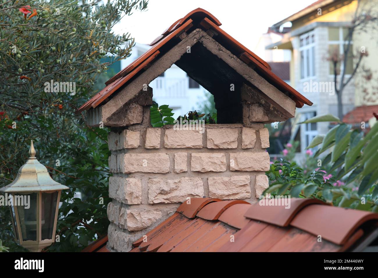 A beautiful closeup view of a stoned chimney oven for grilling in Croatia Stock Photo