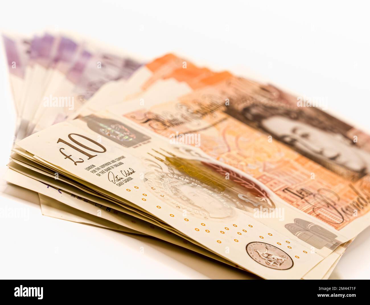 a detailed close-up of new fanned plastic GBP £ Sterling 10 Ten and 20 Twenty pound note currency Stock Photo