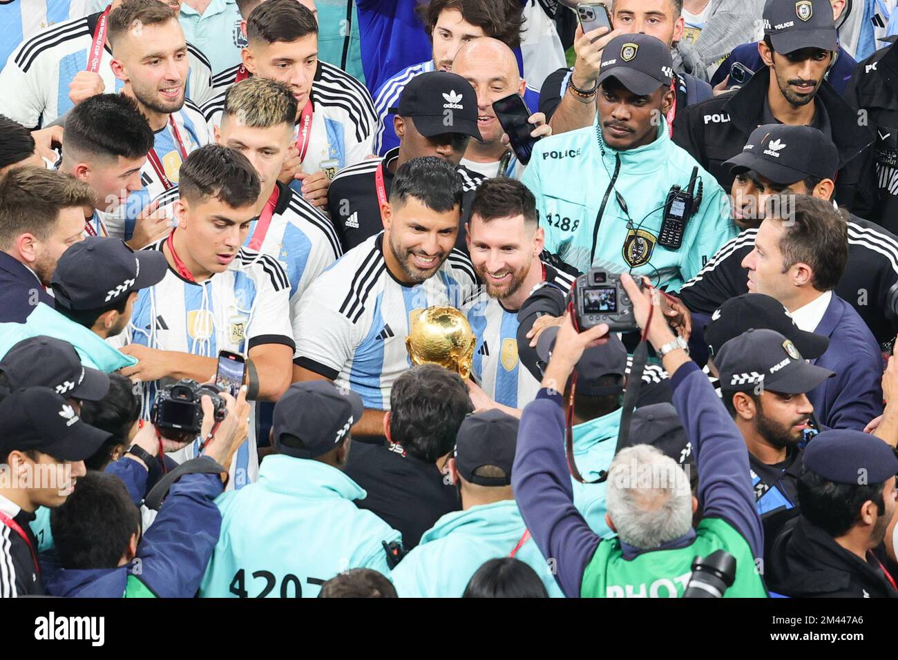Lusail, Qatar. 18th Dec, 2022. Sergio Aguero Argentine and Lionel Messi of Argentina take a selfie with trophy during the Final of the FIFA World Cup Qatar 2022 between Argentina and France at Lusail Stadium, Lusail, Qatar on 18 December 2022. Photo by Peter Dovgan. Editorial use only, license required for commercial use. No use in betting, games or a single club/league/player publications. Credit: UK Sports Pics Ltd/Alamy Live News Stock Photo