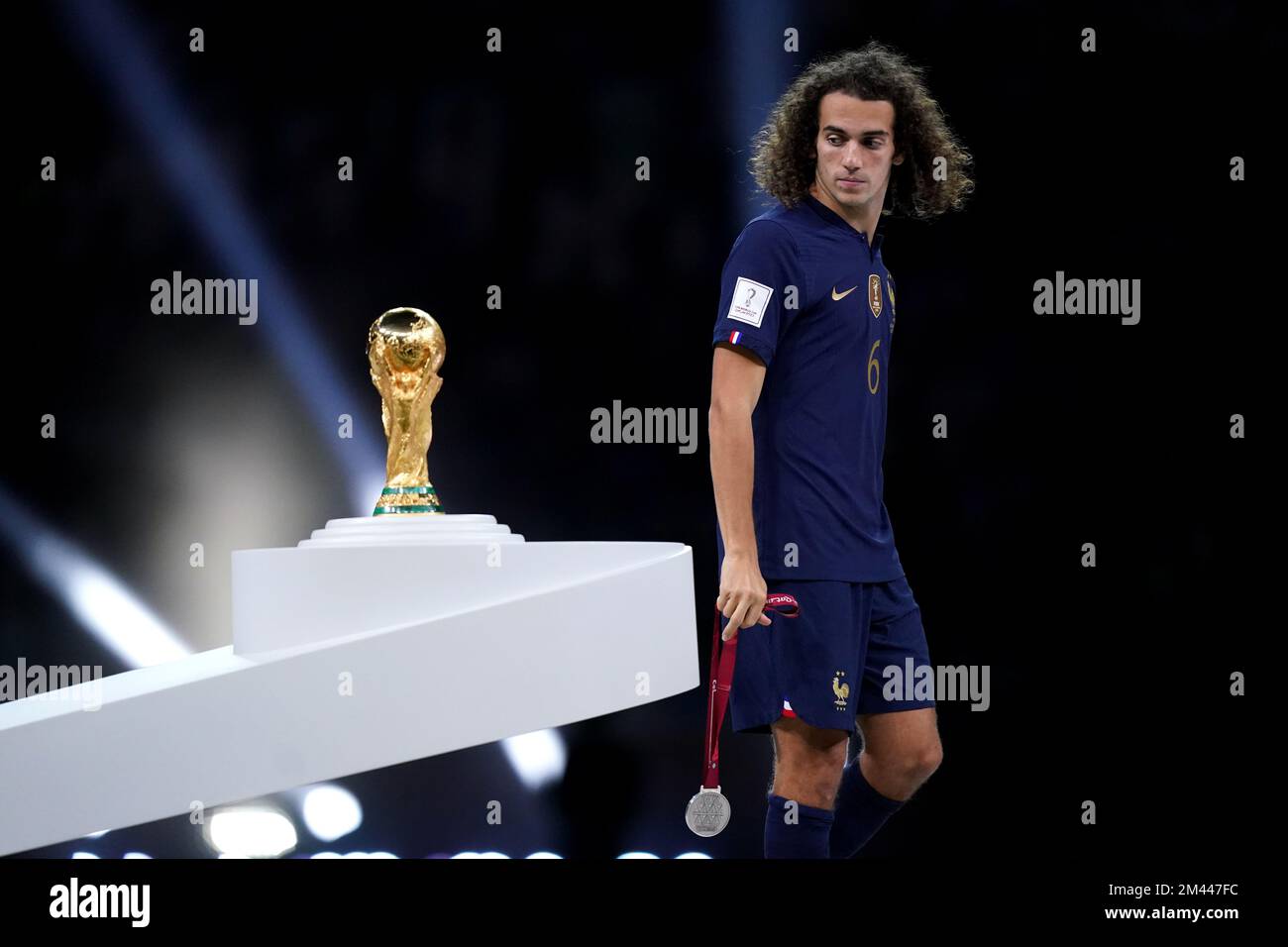 Award ceremony: UPAMECANO Dayot (FRA) walks past the trophy, cup, trophy,  disappointment, frustrated, disappointed, frustrated, rejected, left:  GUENDOUZI Matteo (FRA). Game 64, FINAL Argentina - France 4-2 nE (3-3) on  December 18th