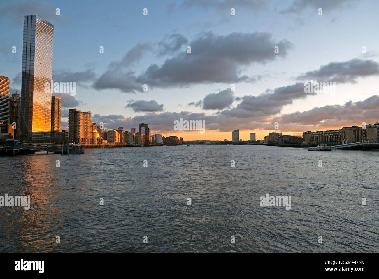 View of riverside corporate buildings at Canary Wharf buildings on Isle of Dogs from River Thames at dusk Isle of Dogs London UK 2022  KATHY DEWITT Stock Photo