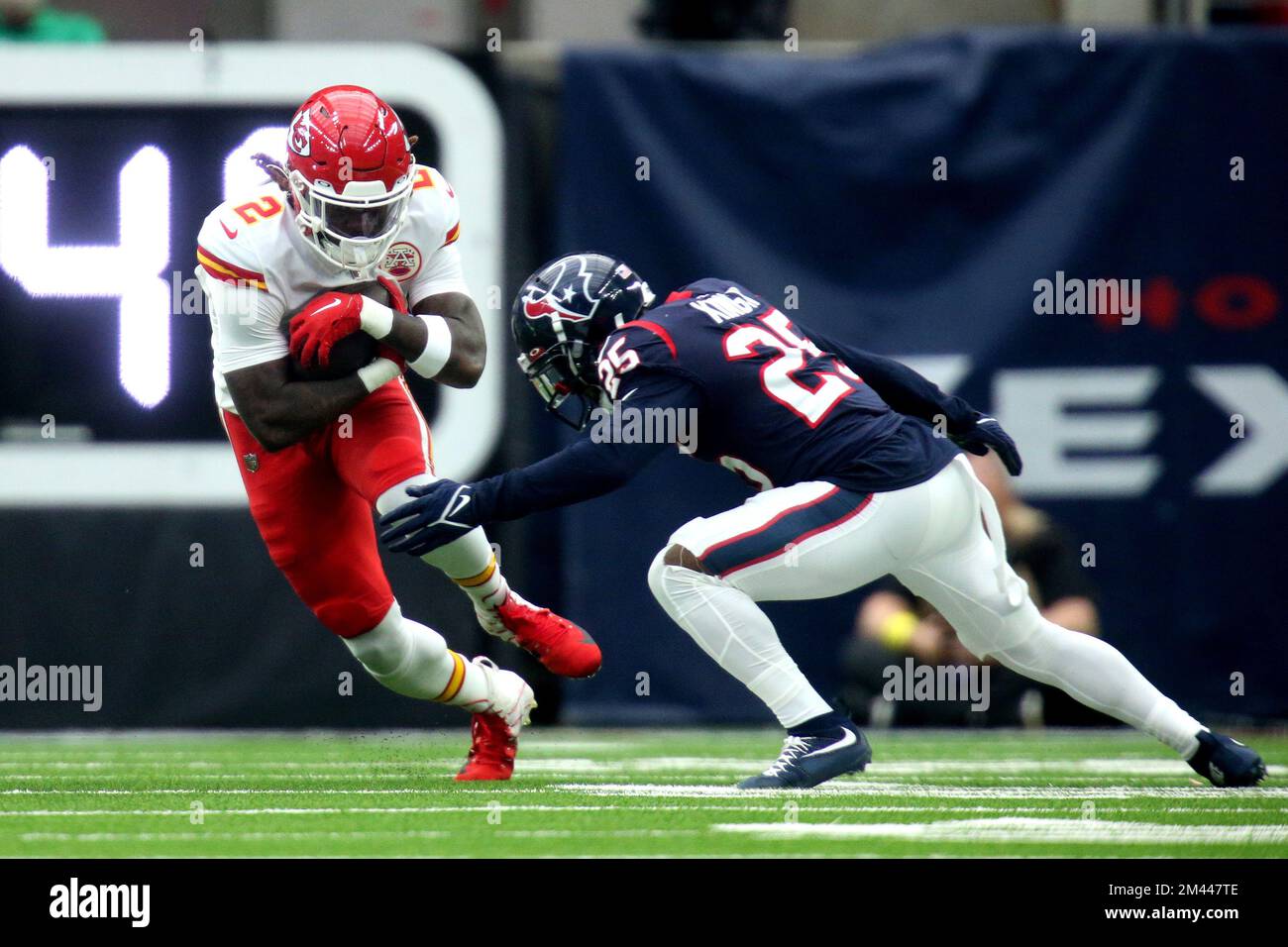 Houston, Texas, USA. 18th Dec, 2022. Kansas City Chiefs running back Ronald Jones (2) carries the ball while Houston Texans cornerback Desmond King II (25) looks to tackle him during the second quarter between the Houston Texans and the Kansas City Chiefs at NRG Stadium in Houston, TX on December 18, 2022. (Credit Image: © Erik Williams/ZUMA Press Wire) Stock Photo