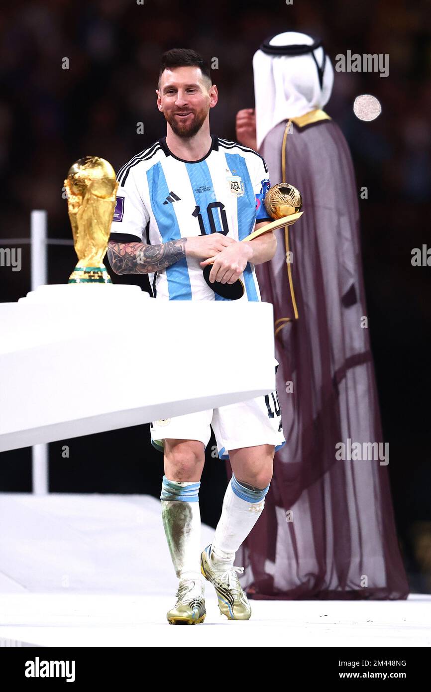 Lusail City, Qatar. 18th Dec, 2022. Lionel Messi of Argentina looks at the FIFA World Cup trophy as he holds the golden ball following the 2022 FIFA World Cup Final at Lusail Stadium in Lusail City, Qatar on December 18, 2022. Photo by Chris Brunskill/UPI Credit: UPI/Alamy Live News Stock Photo