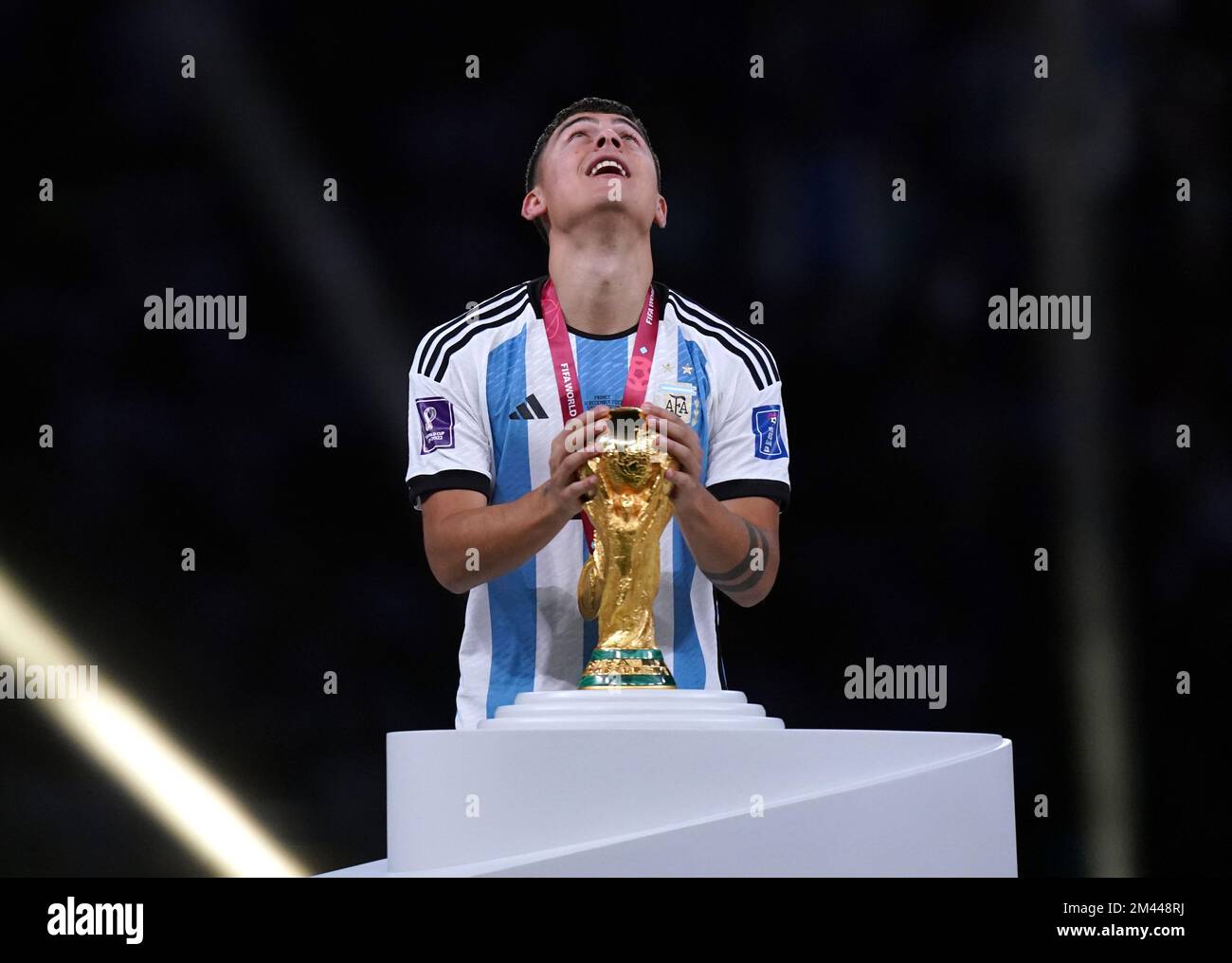 Argentina's Paulo Dybala celebrates with the World Cup trophy before