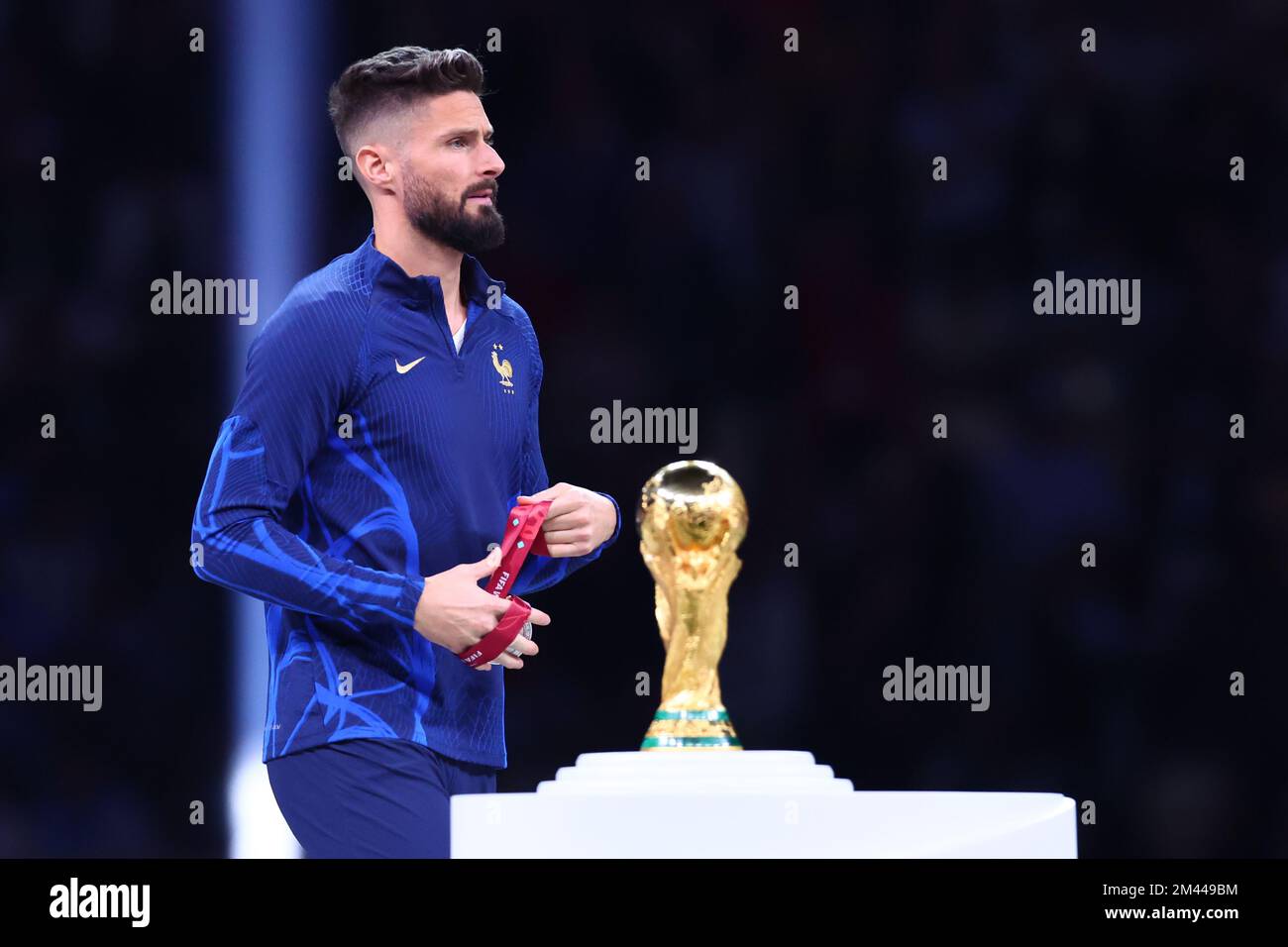 Lusail, Qatar. 18th Dec, 2022. Soccer, World Cup 2022 in Qatar, Argentina - France, Final, at Lusail Stadium, France's Olivier Giroud passes the World Cup trophy. Credit: Tom Weller/dpa/Alamy Live News Stock Photo