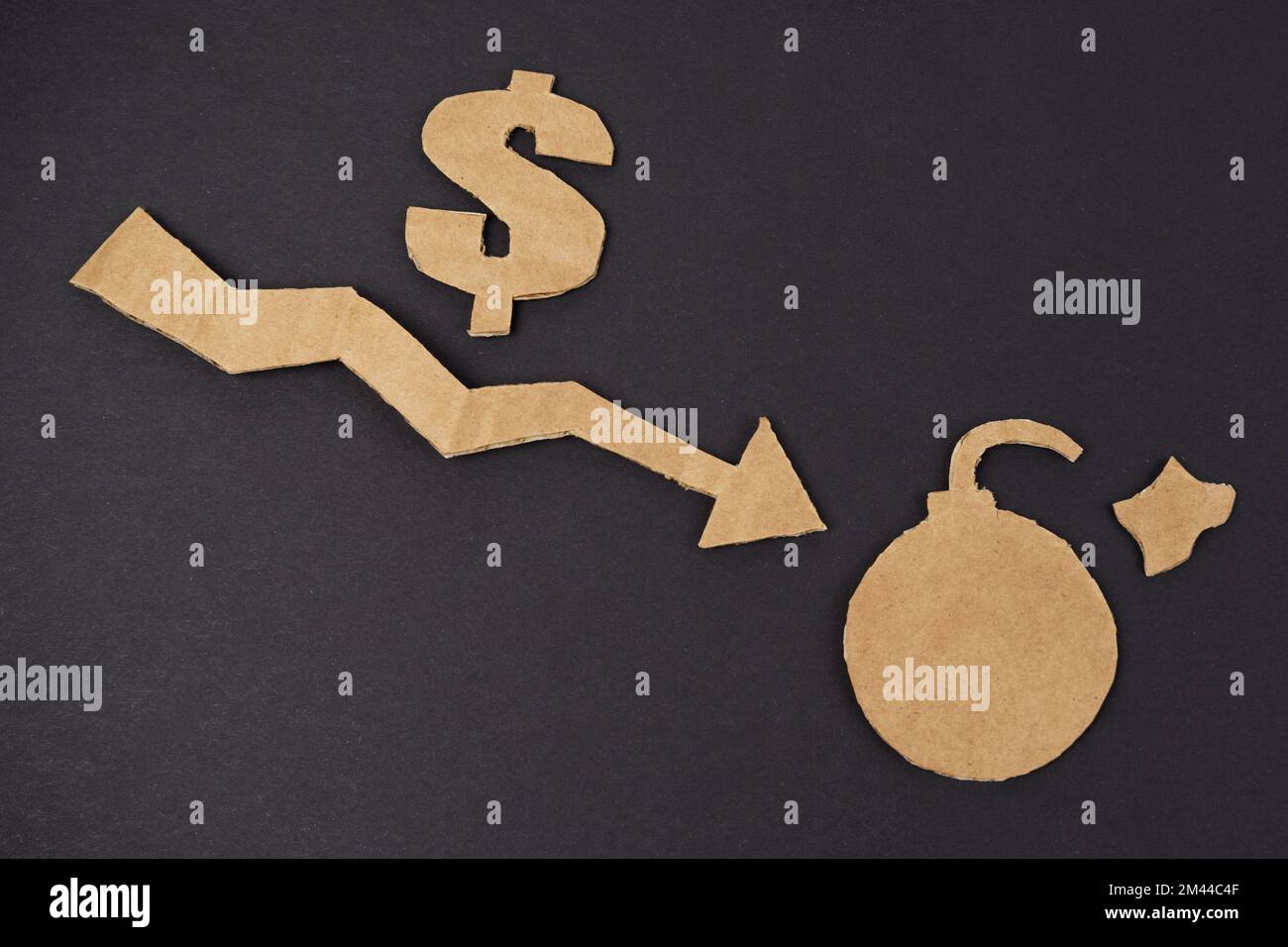 Concept of economic crisis. On a black surface, a graph with a down ...