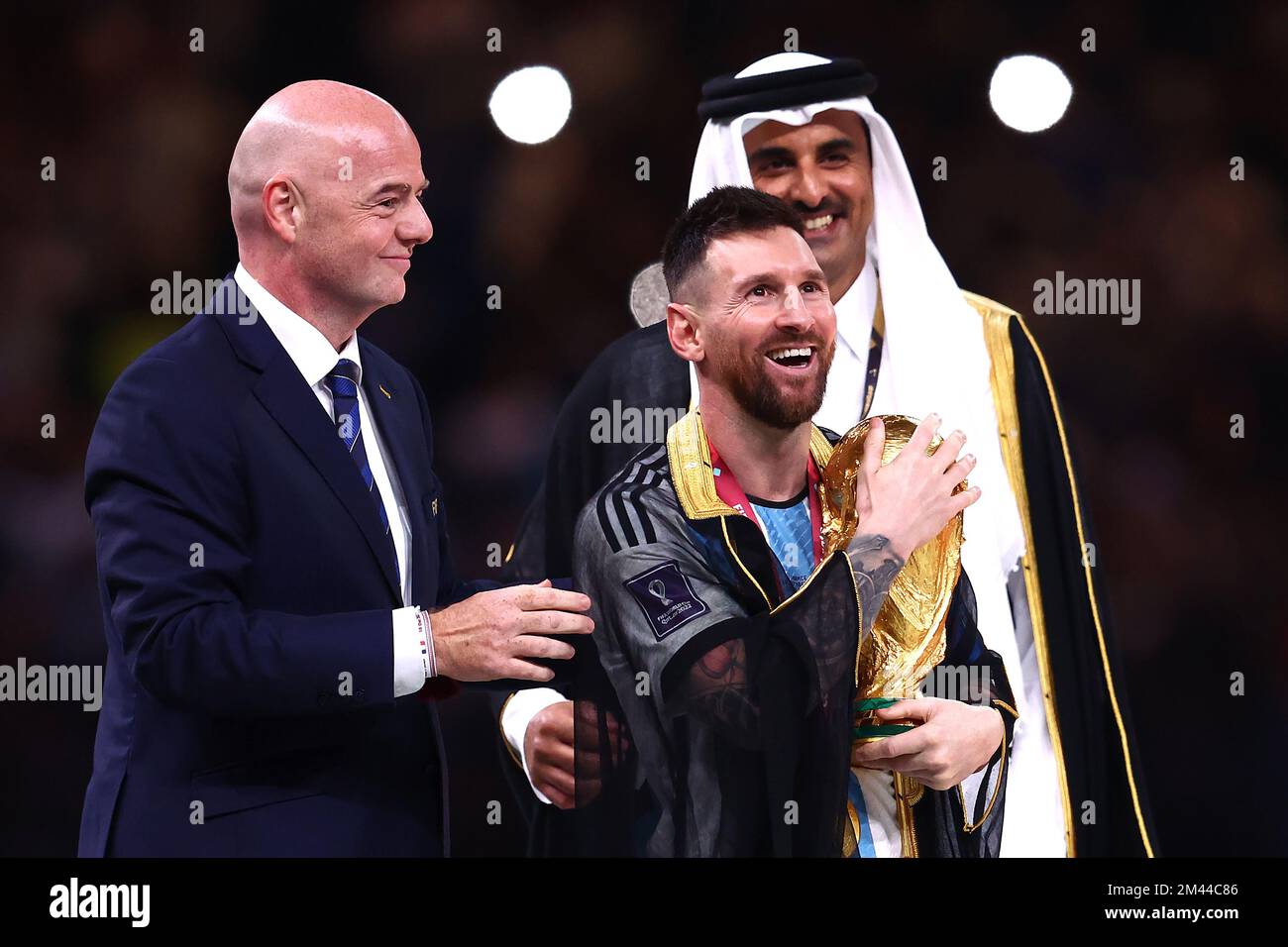 Lusail City, Qatar. 18th Dec, 2022. Lionel Messi of Argentina holds the FIFA World Cup trophy as FIFA President Gianni Infantino looks on following the 2022 FIFA World Cup Final at Lusail Stadium in Lusail City, Qatar on December 18, 2022. Photo by Chris Brunskill/UPI Credit: UPI/Alamy Live News Stock Photo