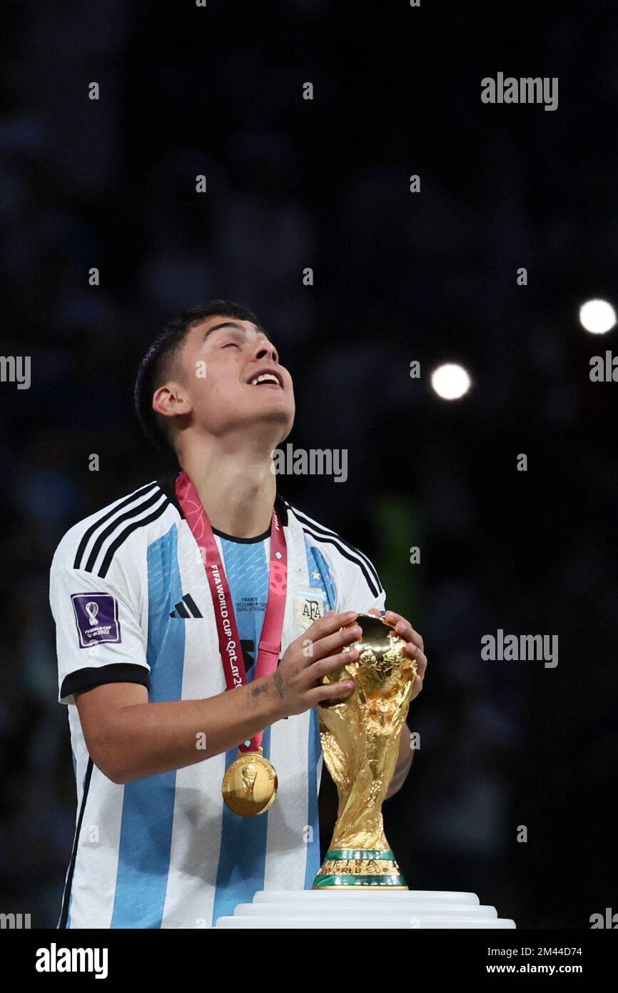 Lusail, Qatar. 18th Dec, 2022. Paulo Dybala of Argentina touches the World Cup Trophy during the awarding ceremony of the 2022 FIFA World Cup at Lusail Stadium in Lusail, Qatar, Dec. 18, 2022. Credit: Lan Hongguang/Xinhua/Alamy Live News Stock Photo