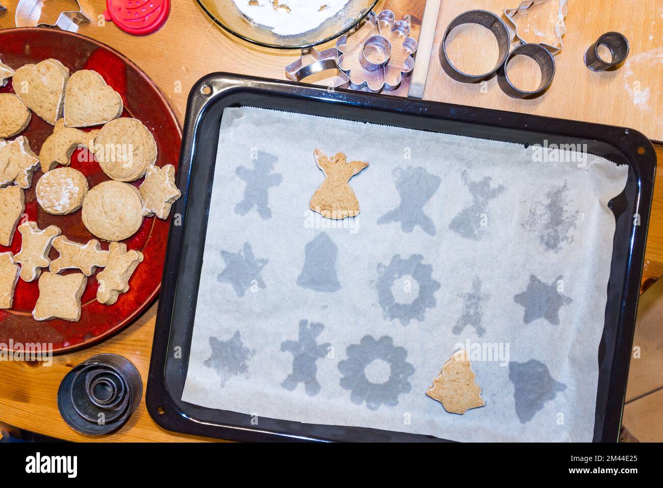 Christmas gingerbread figures baked on baking sheet. Two remained, the rest removed. Stock Photo