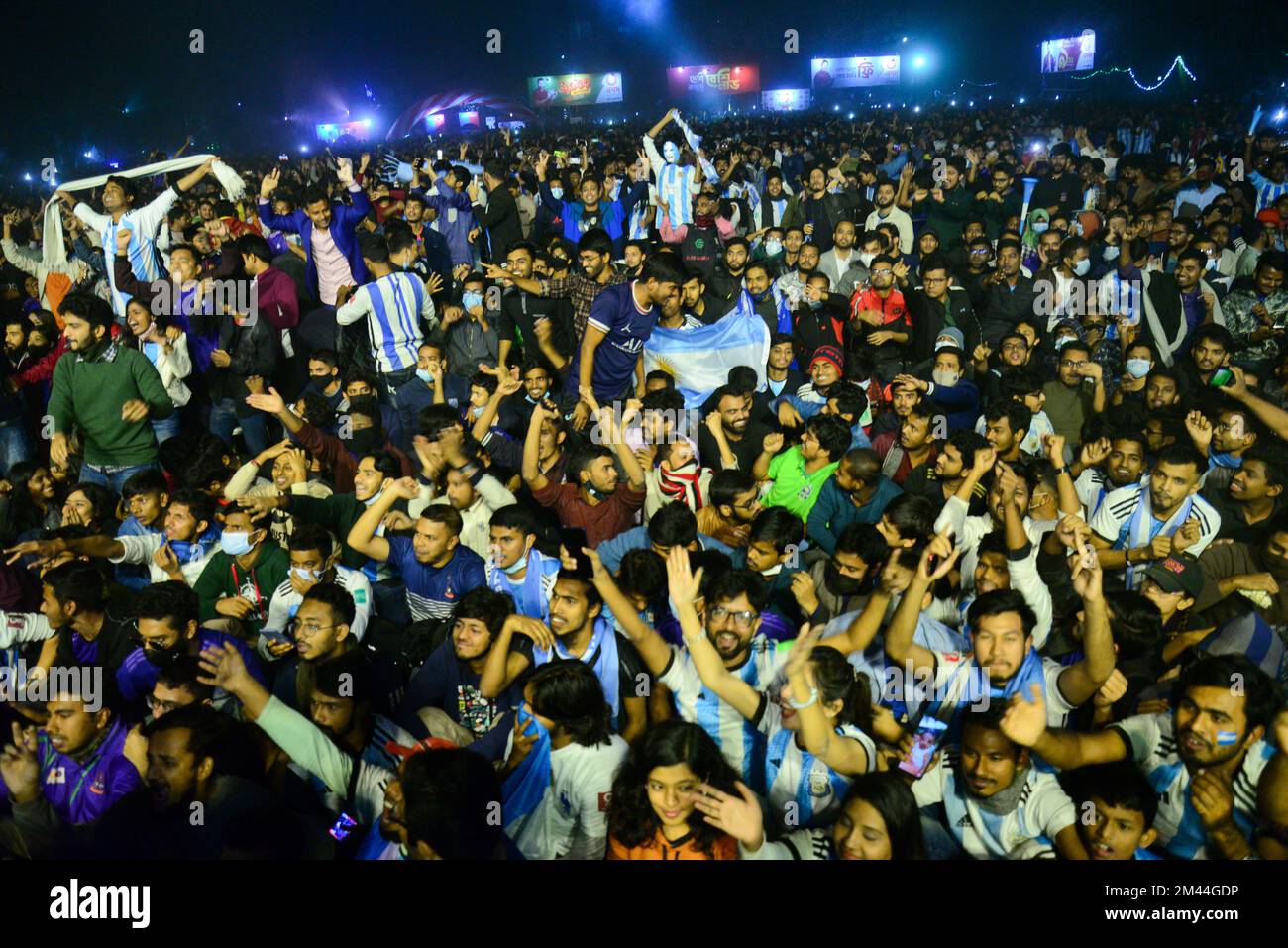 Bangladeshi Argentinian supporters react as they watch the final