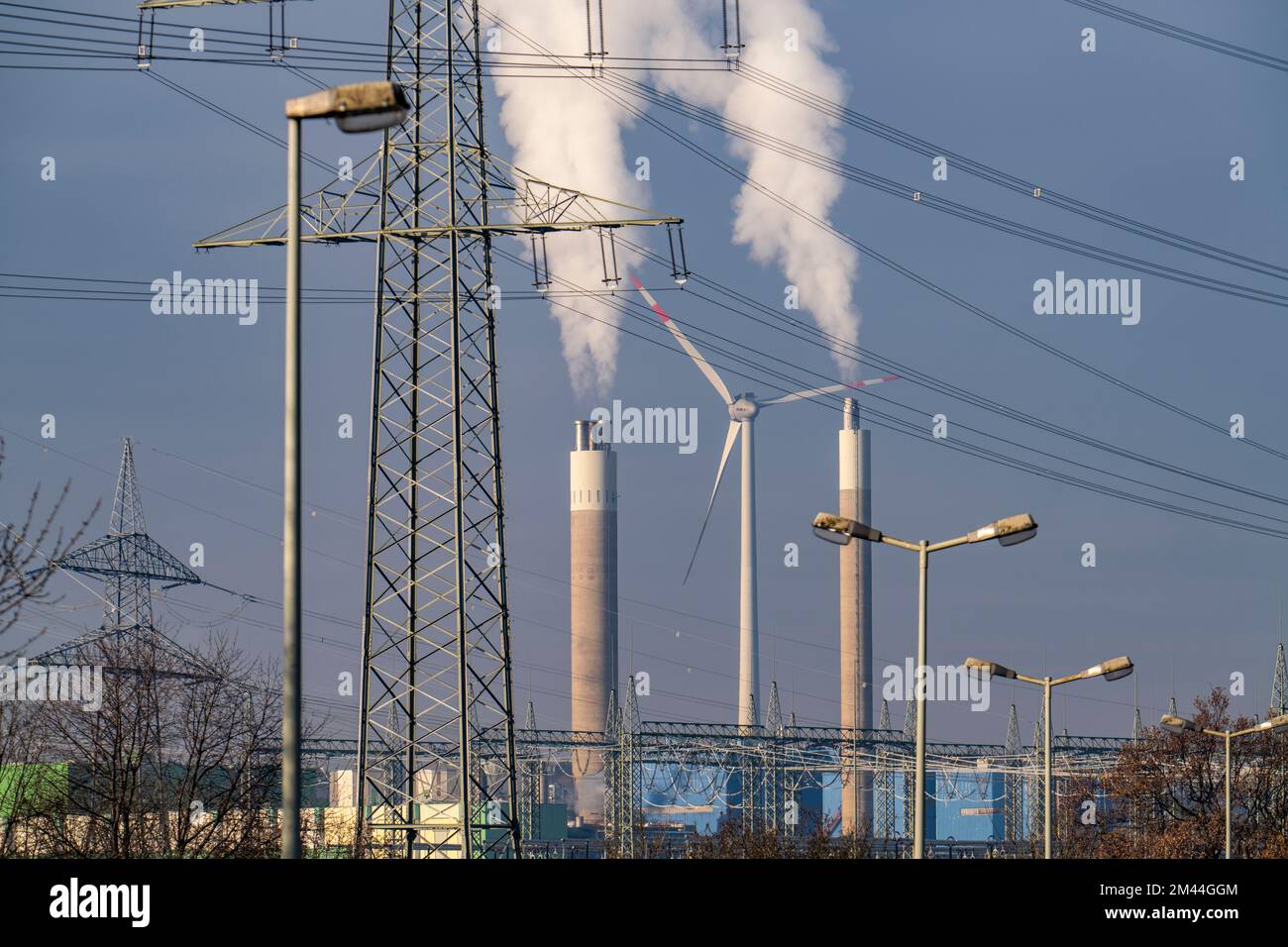 High-voltage power line, high-voltage pylon, chimney of the waste-fired power plant RZR Herten, waste incineration, wind power plant on the Hoppenbruc Stock Photo