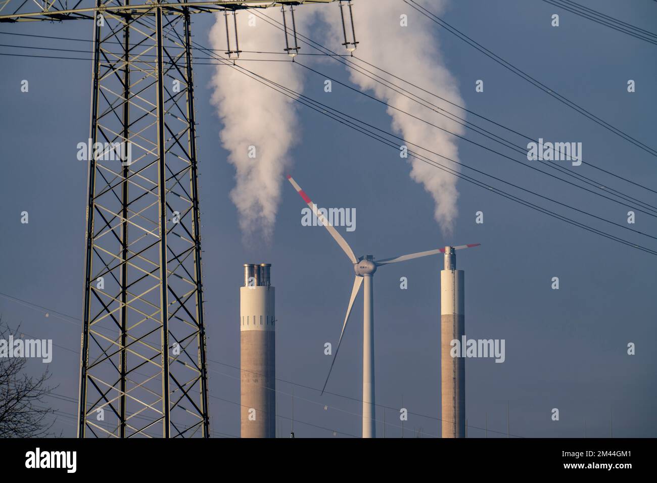 High-voltage power line, high-voltage pylon, chimney of the waste-fired power plant RZR Herten, waste incineration, wind power plant on the Hoppenbruc Stock Photo