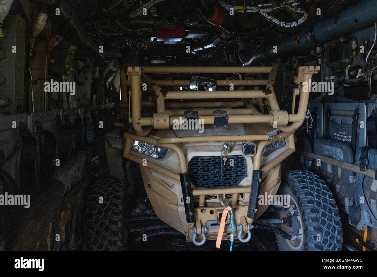 A U.S. Marine Corps Utility Task Vehicle (UTV) is boarded onto a V-22 ...