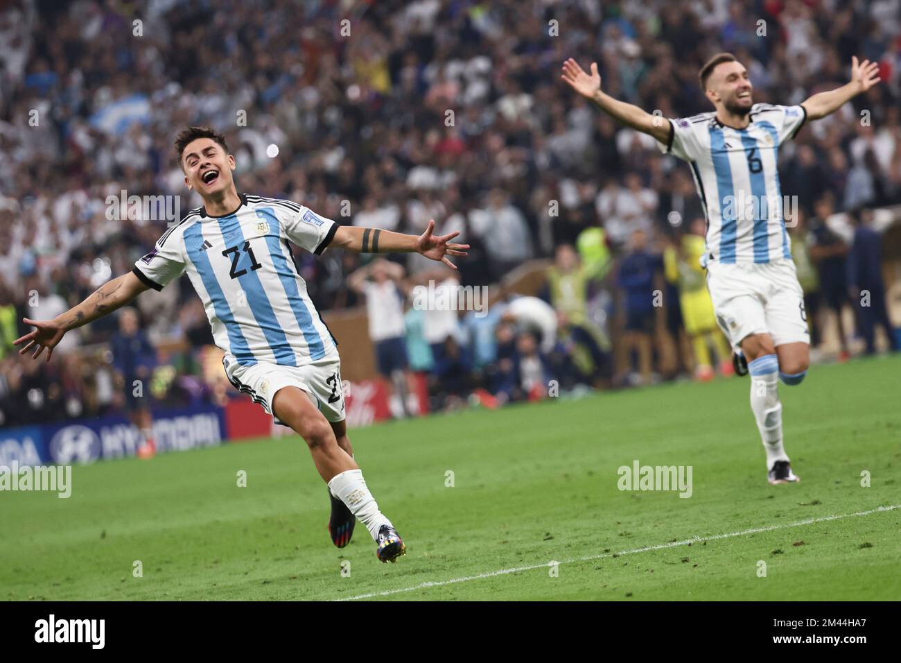 Lusail, Qatar. 18th Dec, 2022. Paulo Dybala (L) and German Pezzella of Argentina celebrate after the team winning the Final between Argentina and France at the 2022 FIFA World Cup at Lusail Stadium in Lusail, Qatar, Dec. 18, 2022. Credit: Lan Hongguang/Xinhua/Alamy Live News Stock Photo