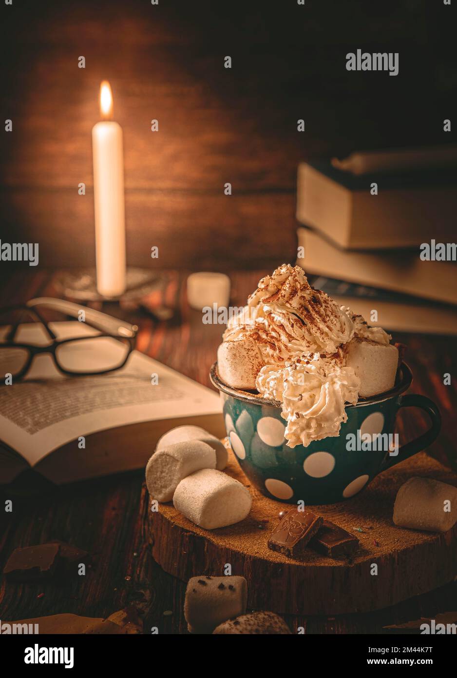 Hot chocolate in candlelight, with marshmallows, food photography Stock