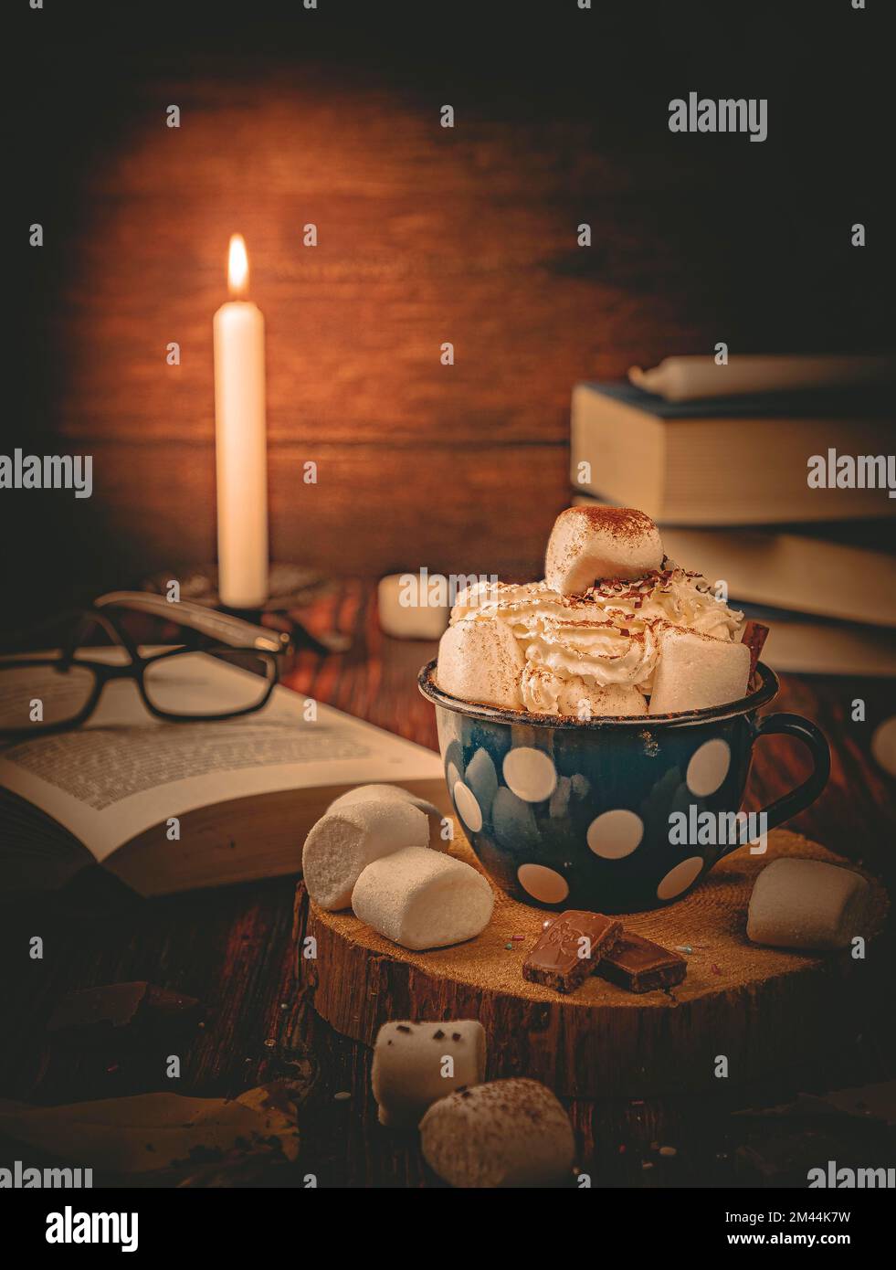 Hot chocolate in candlelight, with marshmallows, food photography Stock