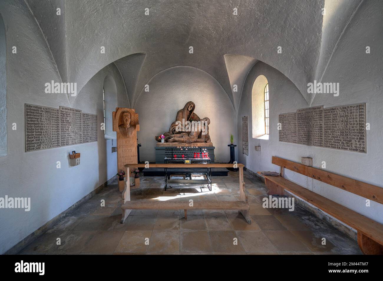 Statue of Father Rupert Mayer by sculptor Michael Vogler and Pieta, Seelenkapelle from 1492, the former ossuary, Oberstdorf, Allgaeu, Bavaria, Germany Stock Photo