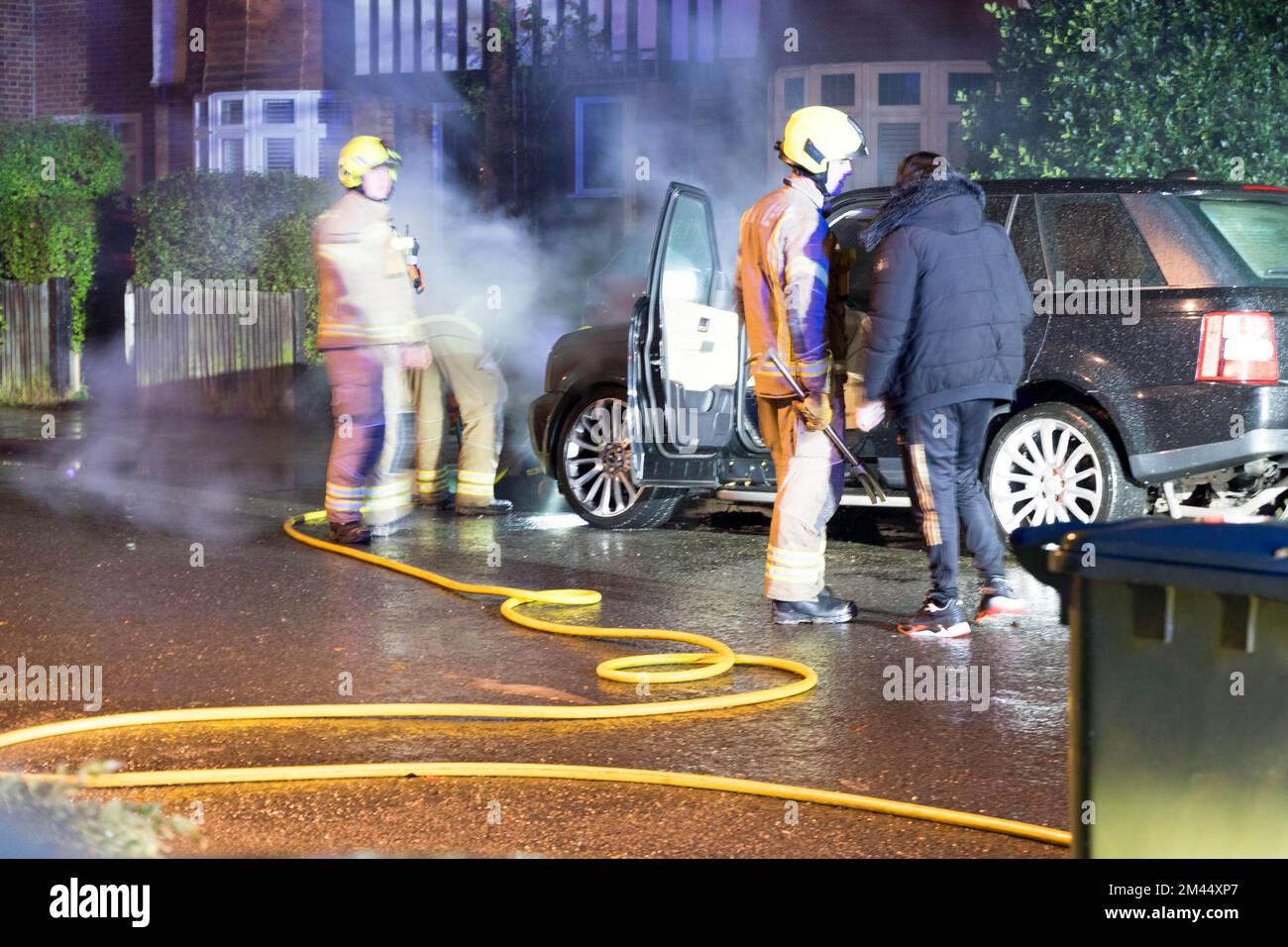 London UK 18 December 2022. Firebrigade put out a car engine fire of land ranger on a residential street near Blackheath London England, Credit: glosszoom/Alamy Live News Stock Photo