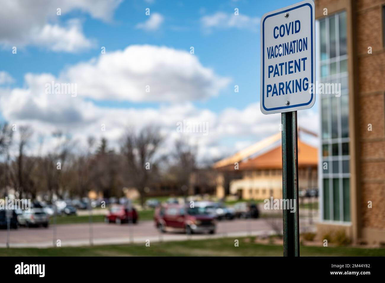 COVID vaccination site with sign and empty parking Stock Photo