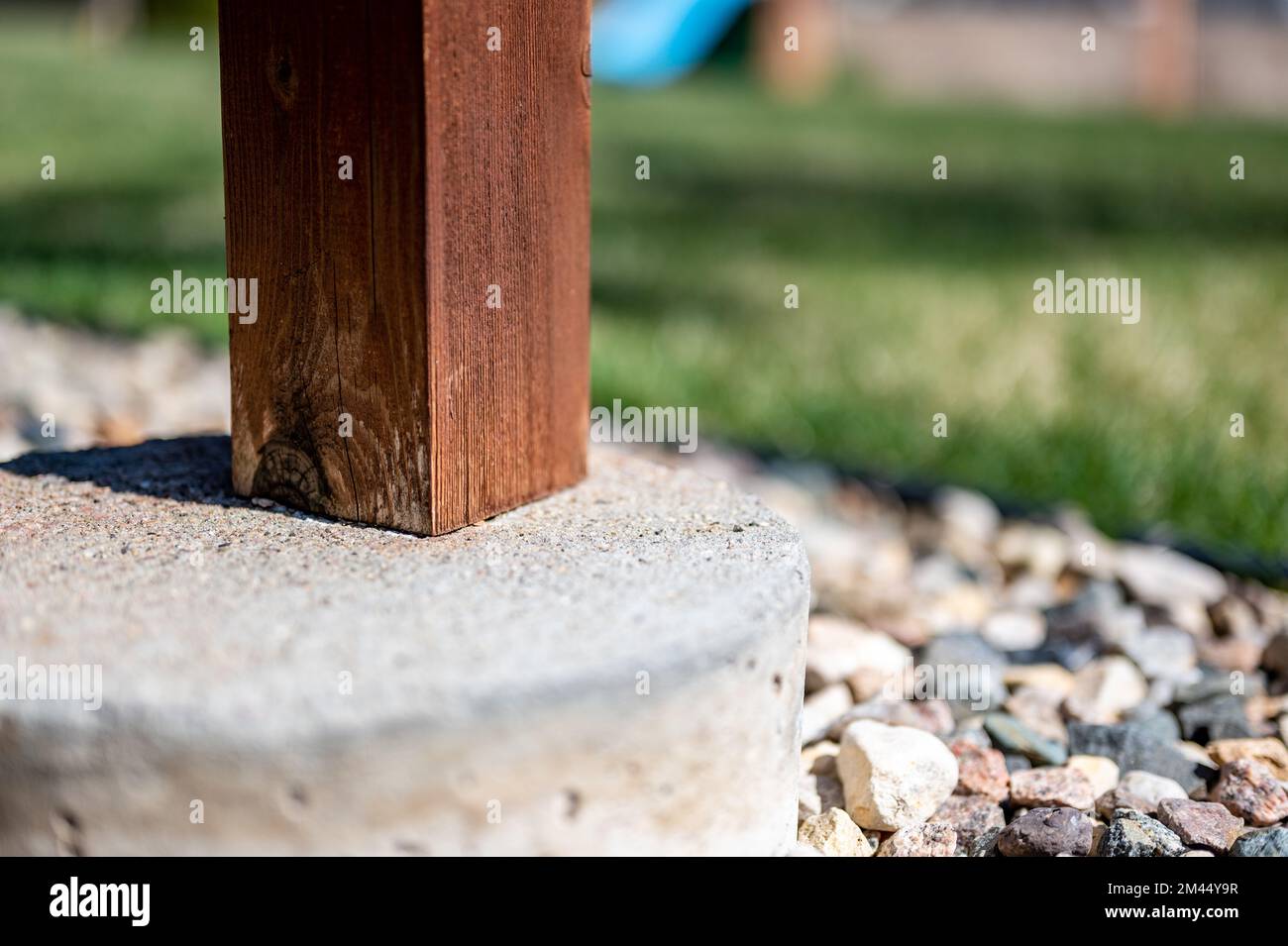 Wooden deck support free-standing on a concrete tube footing Stock Photo