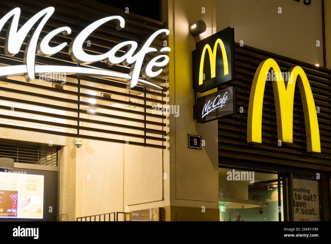 Prague, CZ 08 December 2022 Prague Nightlife. Neon sign with logo of