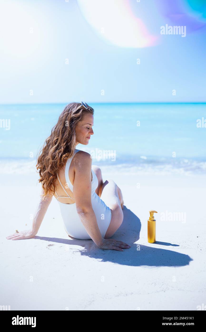 Mature woman enjoying herself on the beach Stock Photo - Alamy