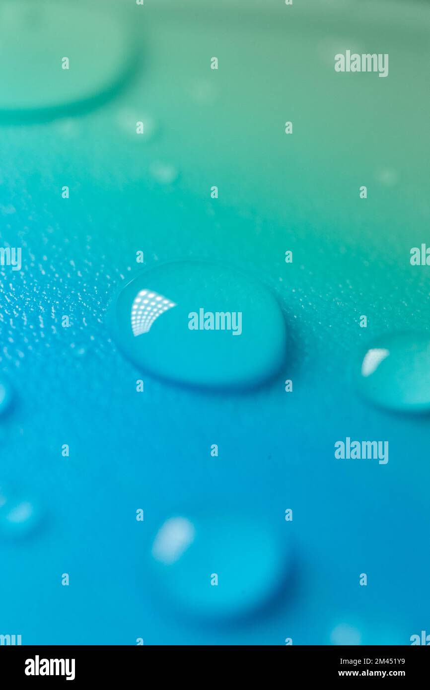 Water drop background.water drops on a blue background with a colored