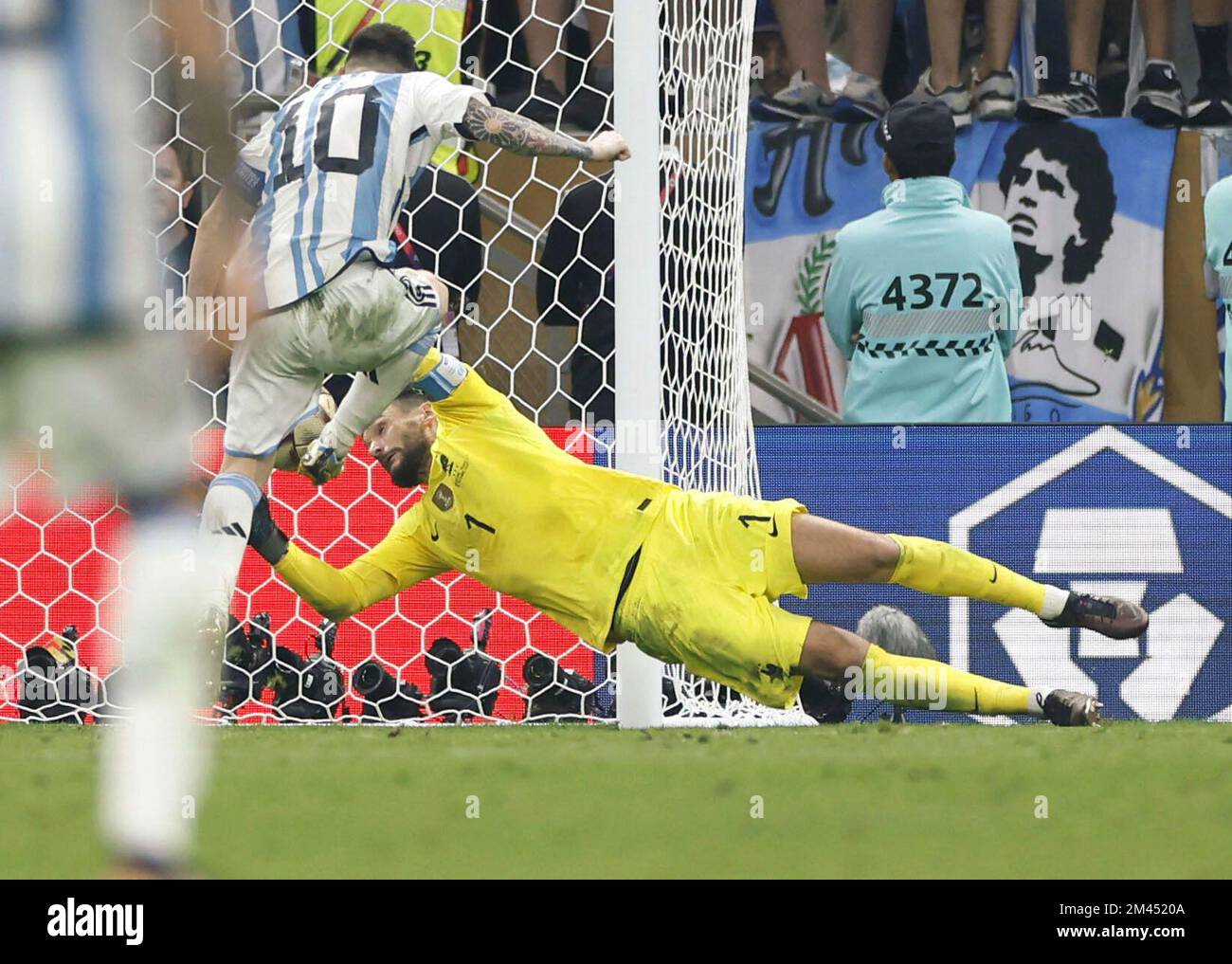 Lusail, Qatar, on Dec. 18, 2022. France goalkeeper Hugo Lloris fails to  stop a shot from Argentina's Lionel Messi (10) during the second half of  extra time in the World Cup football