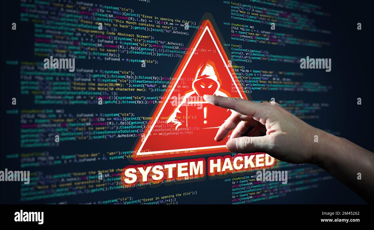Hand Pointing Abstract Modern tech of Programming code screen with Warning alert of System hacked. Virus, Malware, Cyber attack, and Internet cyber. Stock Photo