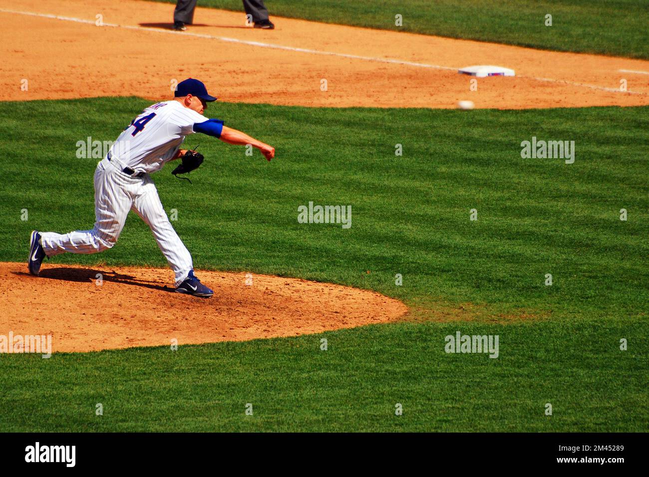 A Chicago Cubs pitcher fires a fastball at Wrigley Field during a baseball game Stock Photo