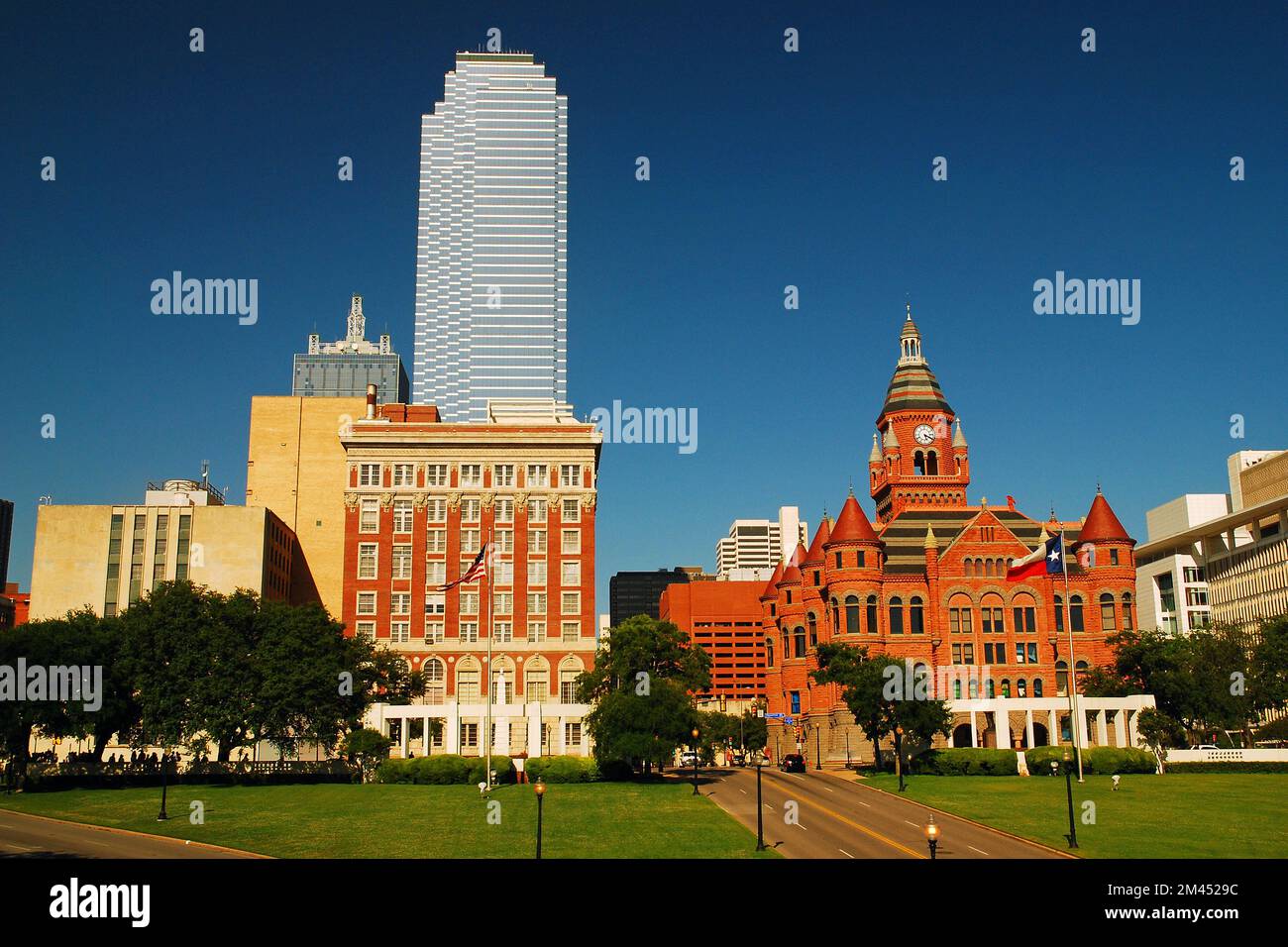 The Bank of America Building and the Old Red Courthouse dominate the skyline around Dealey Plaza in Dallas Texas Stock Photo