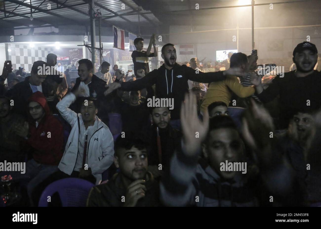 Gaza, Palestine. 18th Dec, 2022. Palestinian soccer fans react during a soccer match between France and Argentina, the final of the 2022 FIFA World Cup, at the Jabalia camp in the northern Gaza Strip. Argentina won penalties 4-2. Credit: SOPA Images Limited/Alamy Live News Stock Photo