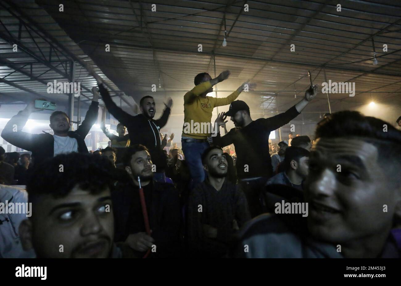 Gaza, Palestine. 18th Dec, 2022. Palestinian soccer fans react during a soccer match between France and Argentina, the final of the 2022 FIFA World Cup, at the Jabalia camp in the northern Gaza Strip. Argentina won penalties 4-2. (Photo by Mahmoud Issa/SOPA Images/Sipa USA) Credit: Sipa USA/Alamy Live News Stock Photo