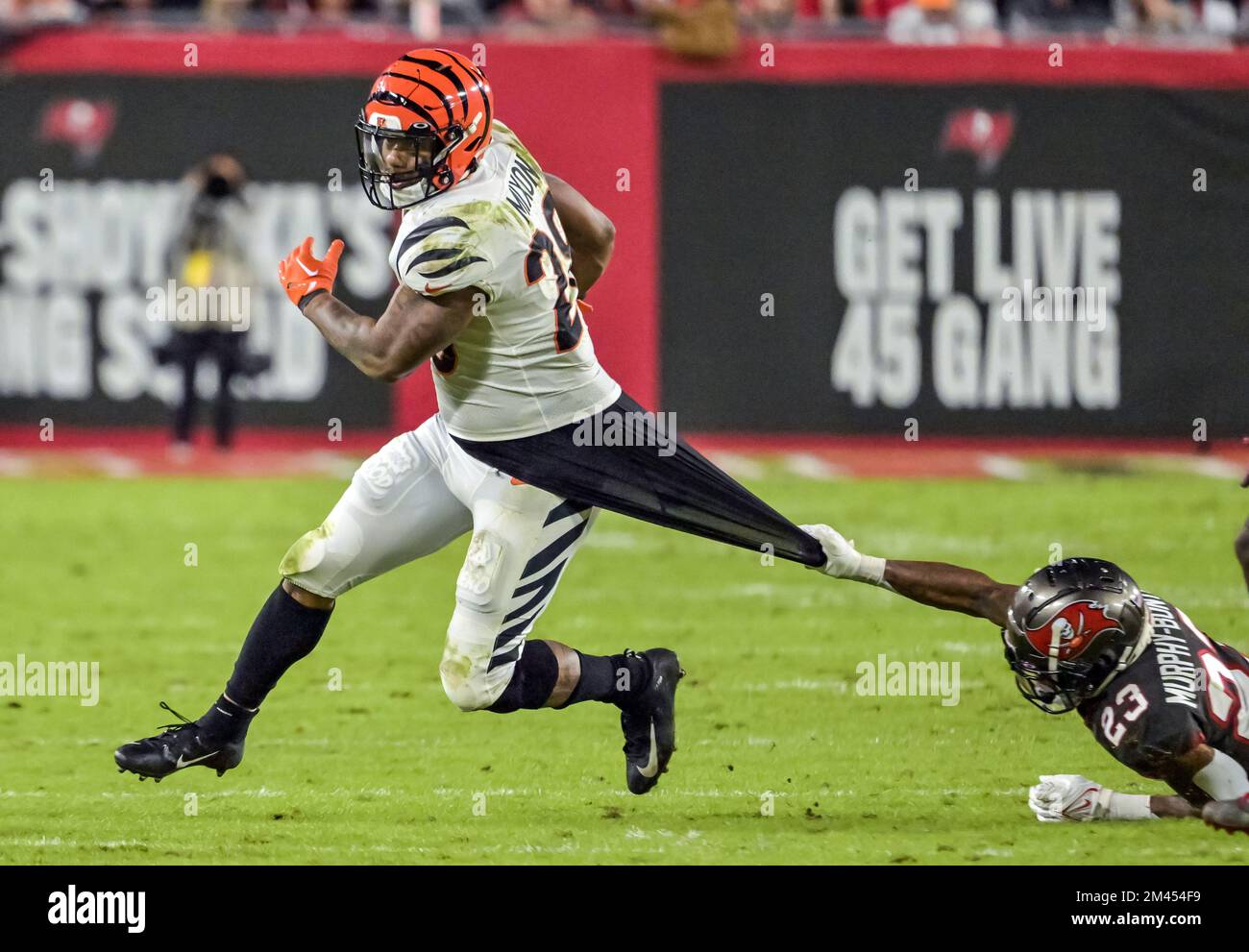 Tampa, United States. 18th Dec, 2022. Tampa Bay Buccaneers cornerback Sean Murphy-Bunting (23) hangs on to the shirt of Cincinnati Bengals running back Joe Mixon (28) for a tackle during the second half at Raymond James Stadium in Tampa, Florida on Sunday, December 18, 2022. Photo by Steve Nesius/UPI. Credit: UPI/Alamy Live News Stock Photo
