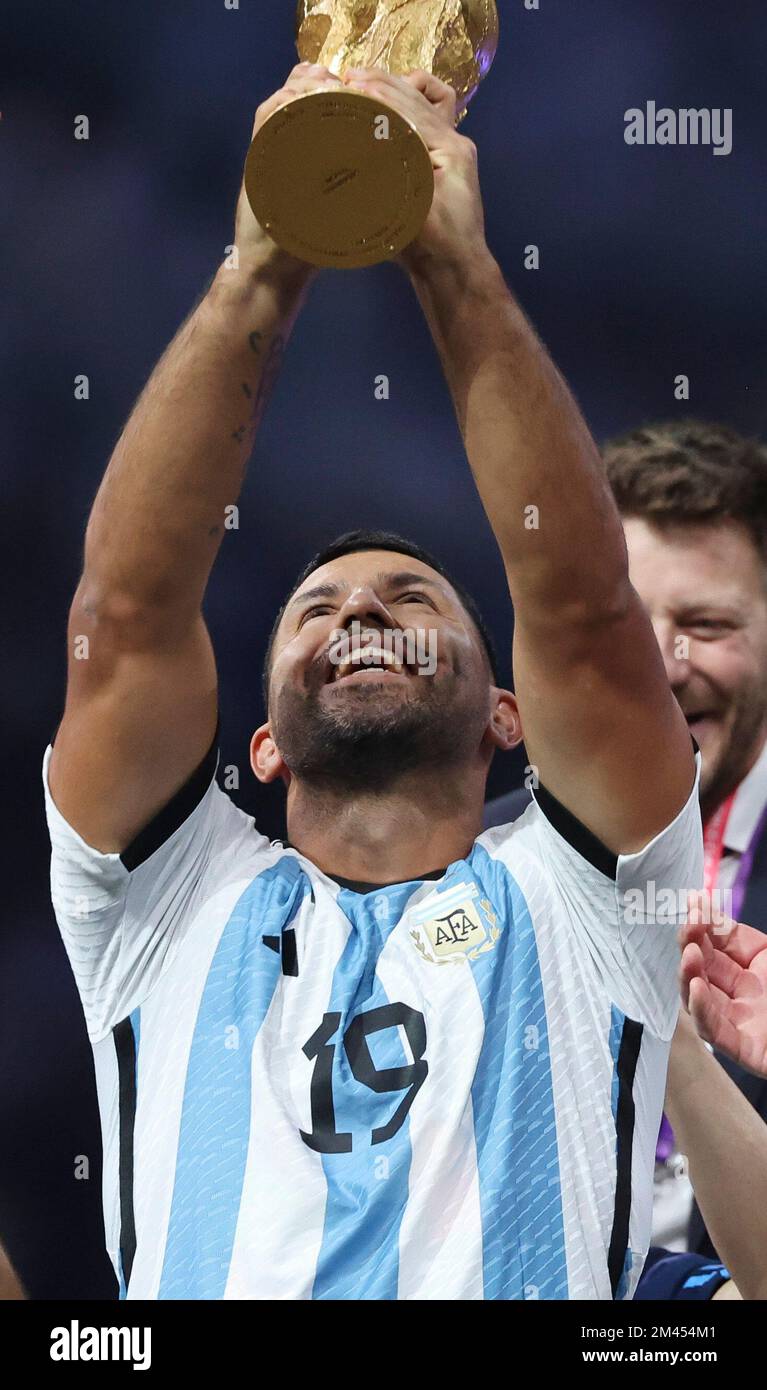Qatar - 18/12/2022, Sergio Kun Aguero of Argentina - holding the World Cup - and teammates celebrate during the trophy ceremony following the FIFA World Cup 2022, Final football match between Argentina and France on December 18, 2022 at Lusail Stadium in Al Daayen, Qatar - Photo Jean Catuffe / DPPI Stock Photo