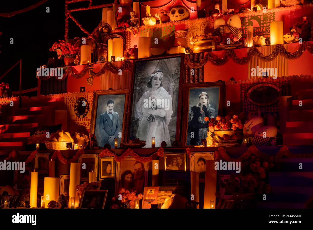 cemetery candles, monument with niches with candles in each space, night day of the dead Stock