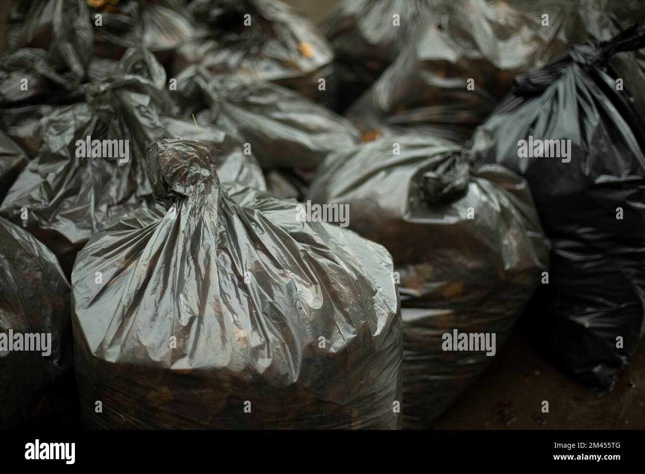 Black garbage bags. Cleaning on street. Waste bags. Black plastic