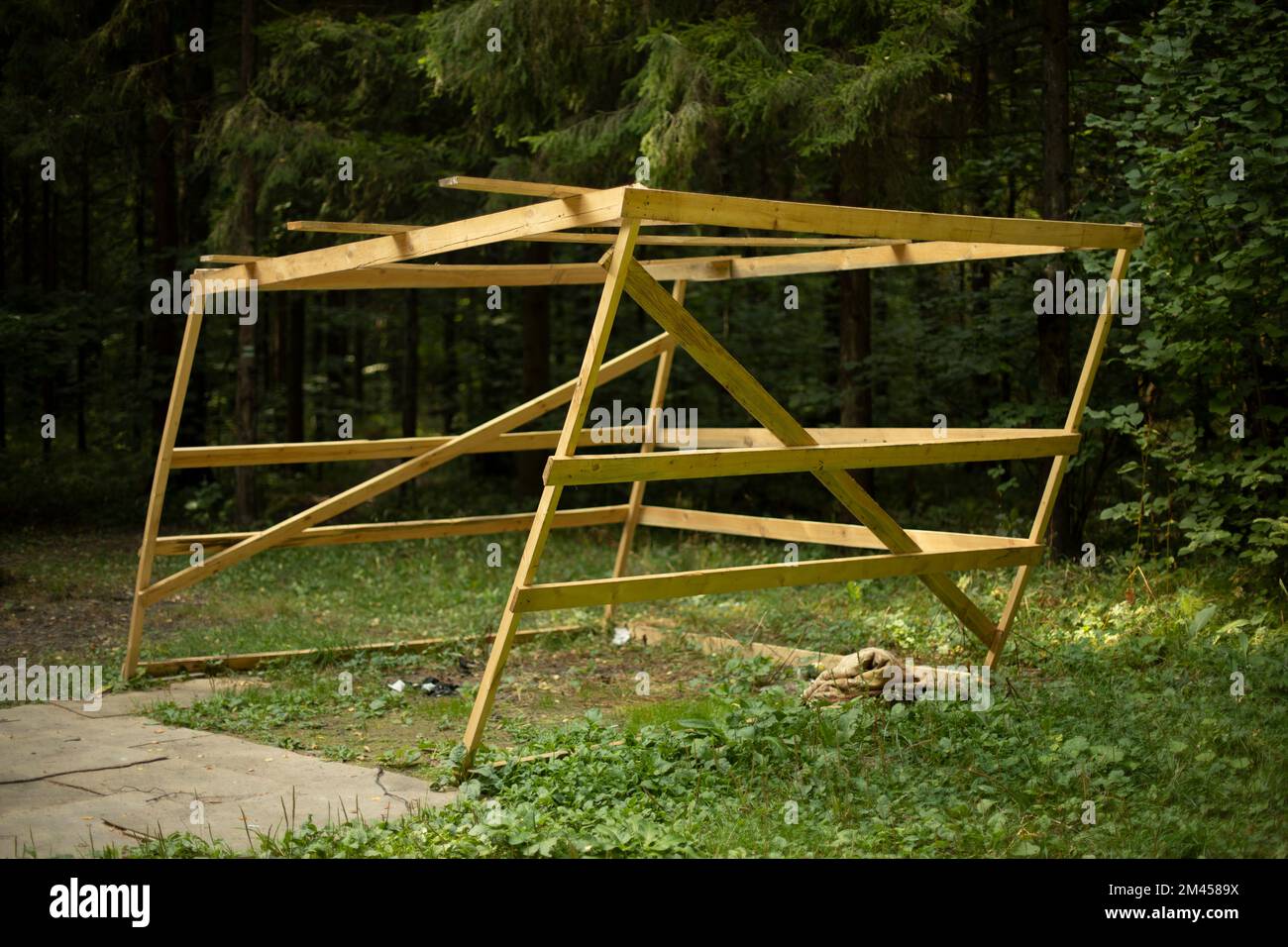 Wooden building in forest. Structure of boards. Details of unsuccessful