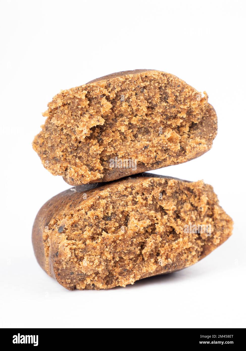 isolated cannabis hash piece, brown hashish on white background. Stock Photo