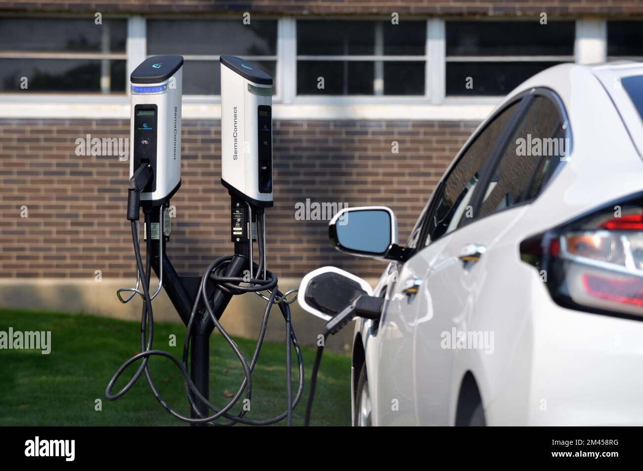 Streamwood, Illinois, USA. An electric vehicle (EV) charging station being used to charge a vehicle used for driver's education. Stock Photo