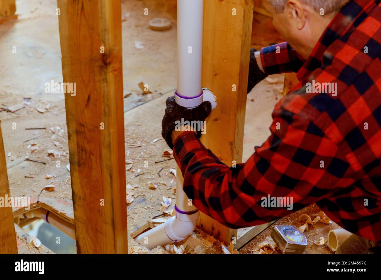 For construction of residential homes plumber glues PVC pipe together