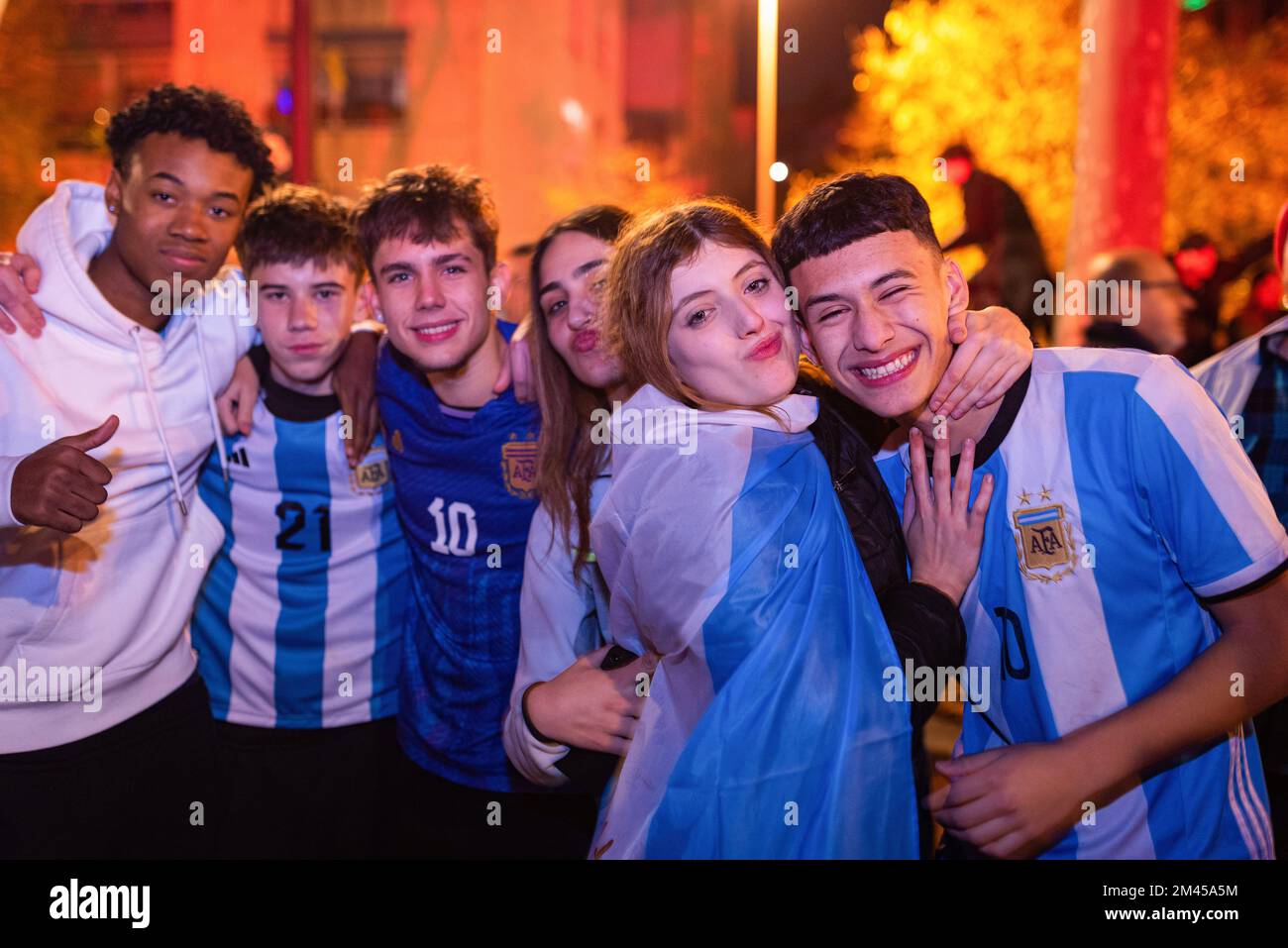Barcelona, Spain. 18th Dec, 2022. A group of young boys and girls wearing  the Argentina t-shirt during celebrations for the victory of the Argentina  football team over France under the Arc de