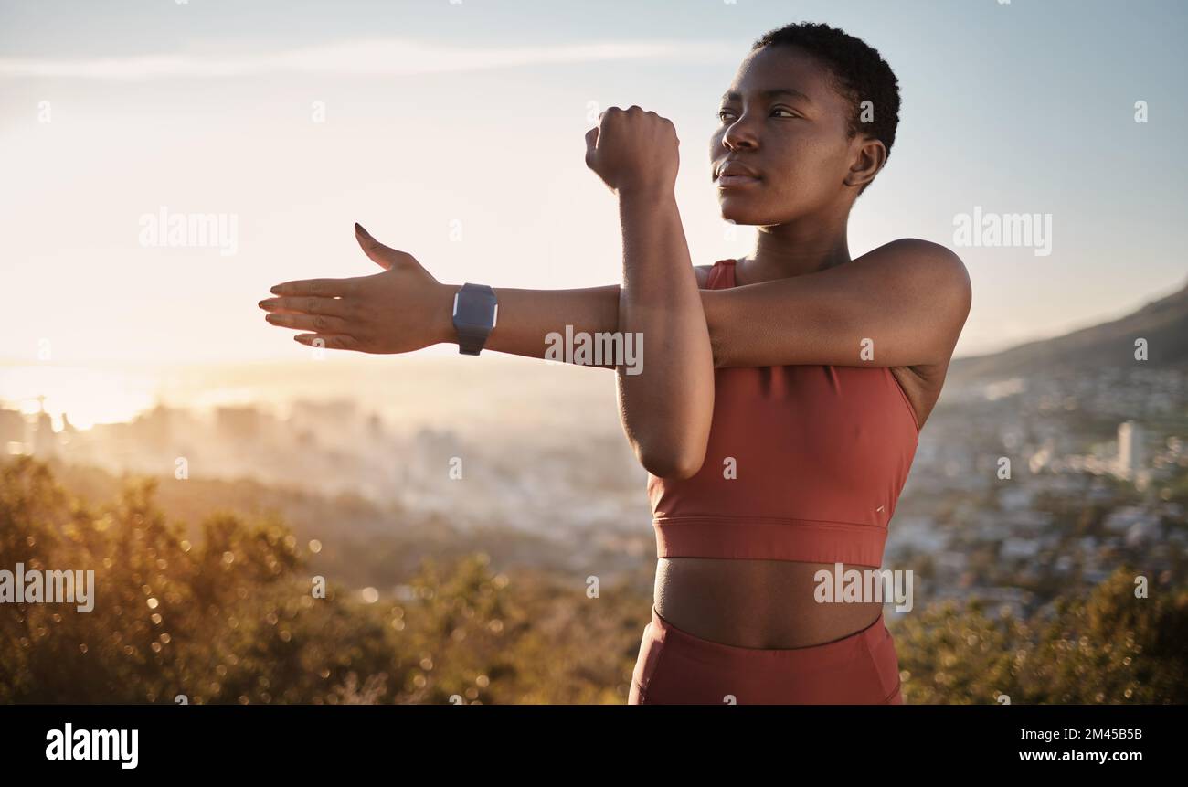 Exercise, fitness and black woman stretching arm outdoors for health and wellness. Thinking