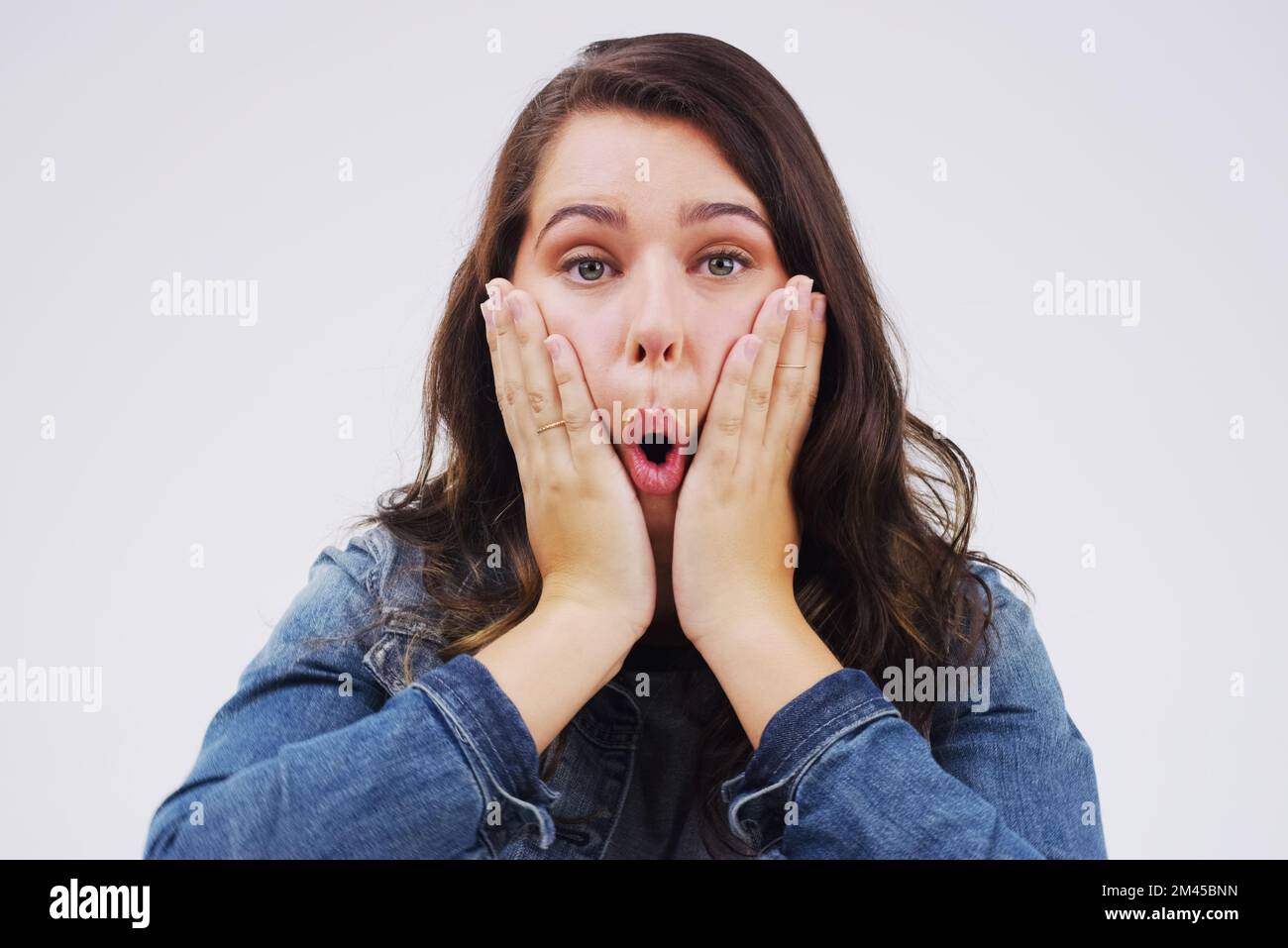 Im absolutely dumbstruck. Studio shot of a young woman making a funny face against a gray background. Stock Photo