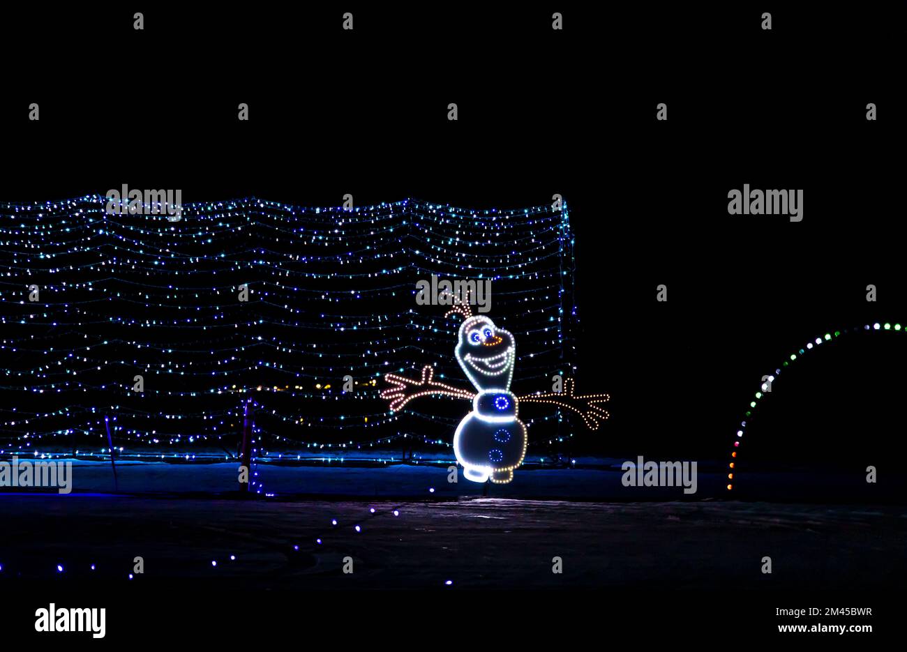 Colorful Christmas decorations LED strip lights against the night sky Stock Photo
