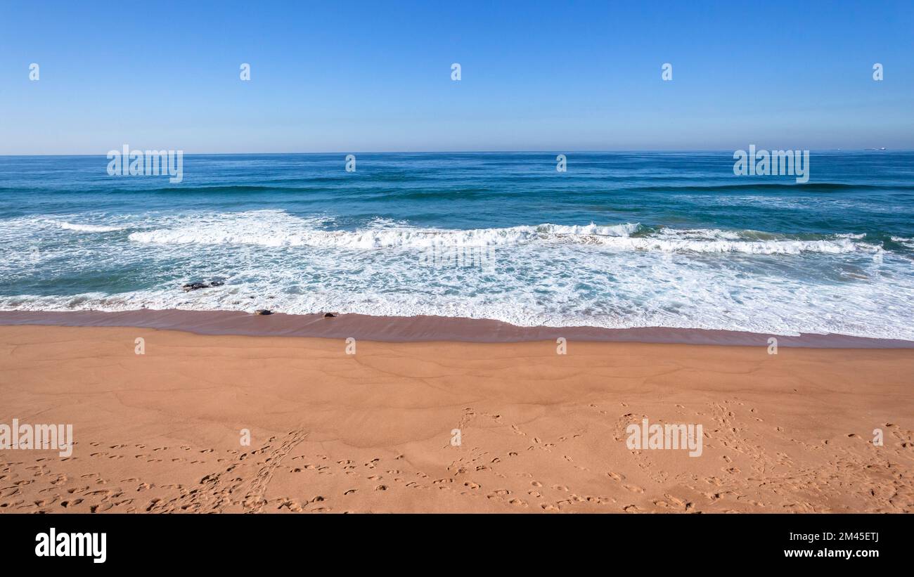 Beach coastline a scenic waters edge blue ocean calm flat sea horizon landscape blue ocean calm flat sea horizon landscape. Stock Photo